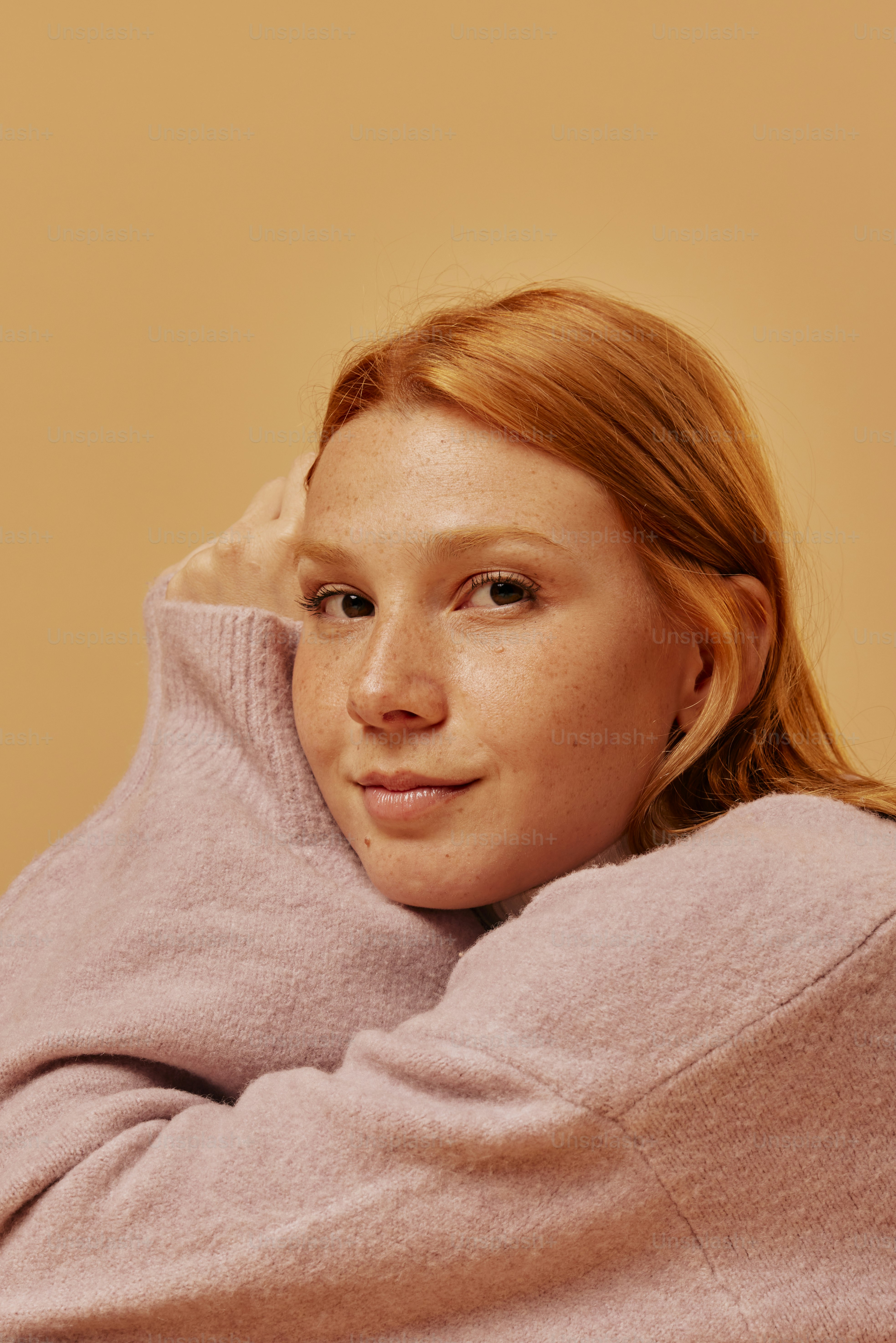 a woman with red hair is posing for a picture