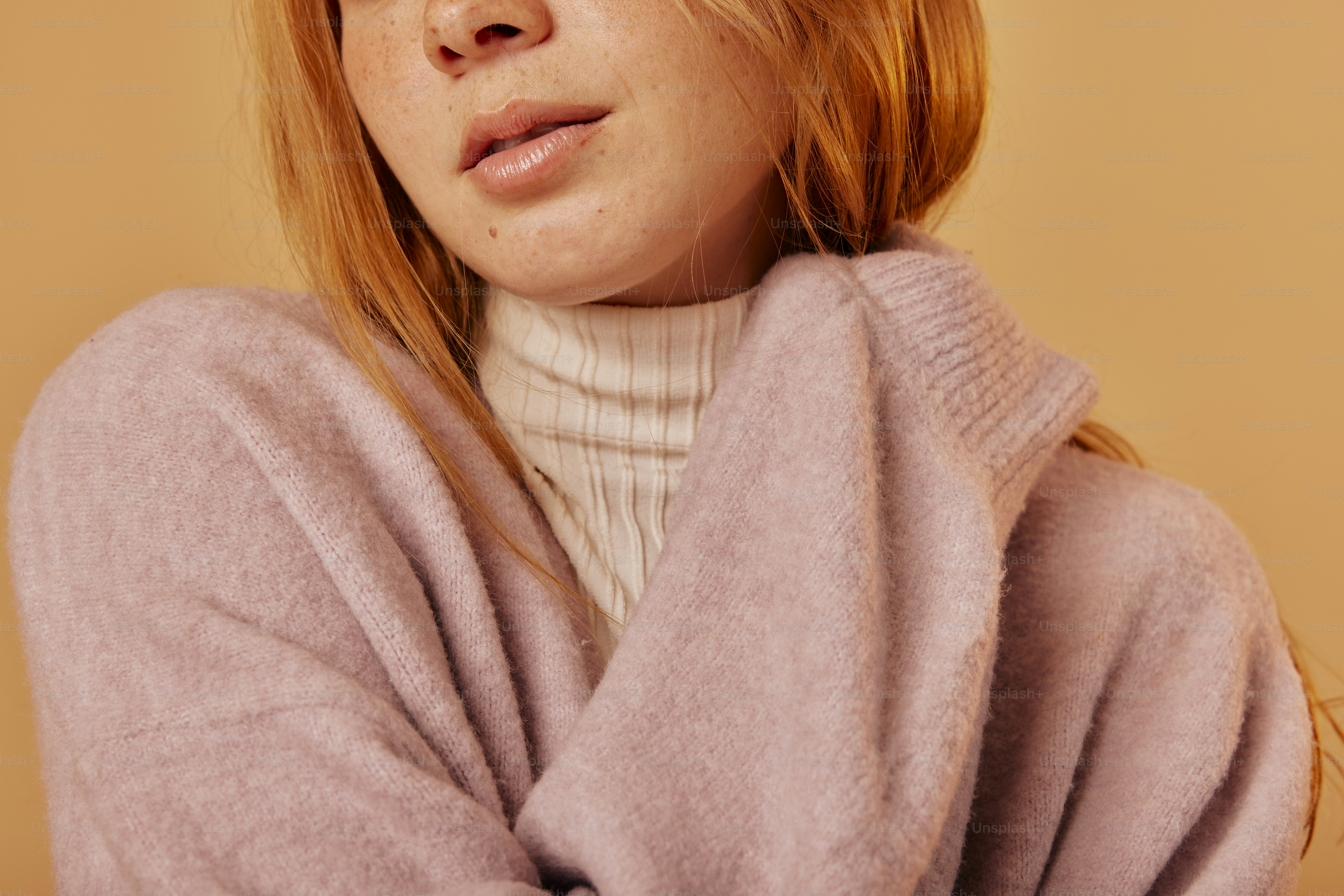 a close up of a person wearing a sweater