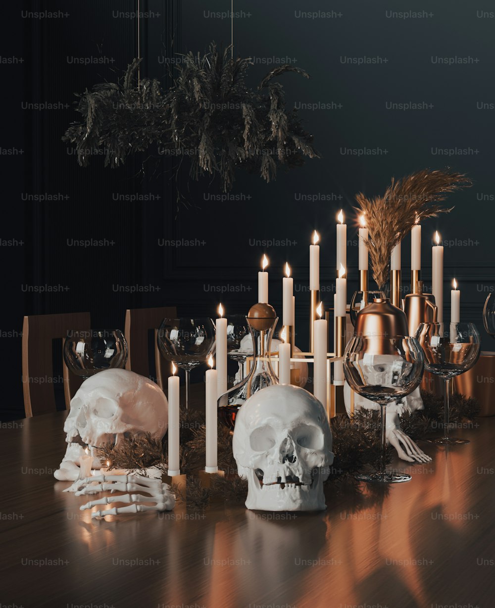 a table topped with lots of candles and skulls