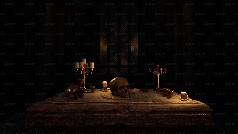 une table avec des bougies et un crâne dessus
