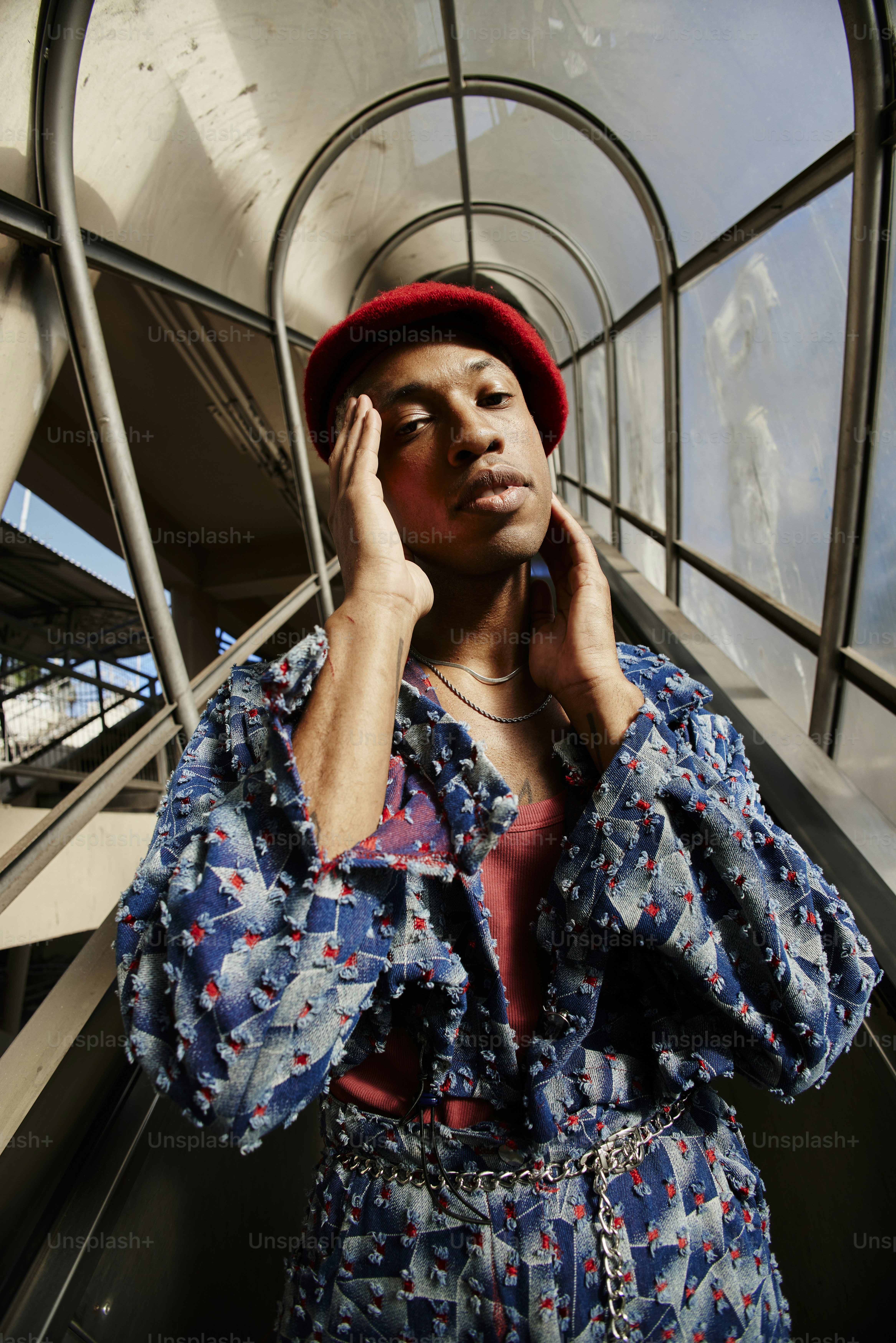 A woman in a red hat is talking on a cell phone photo – Aesthetic Image ...