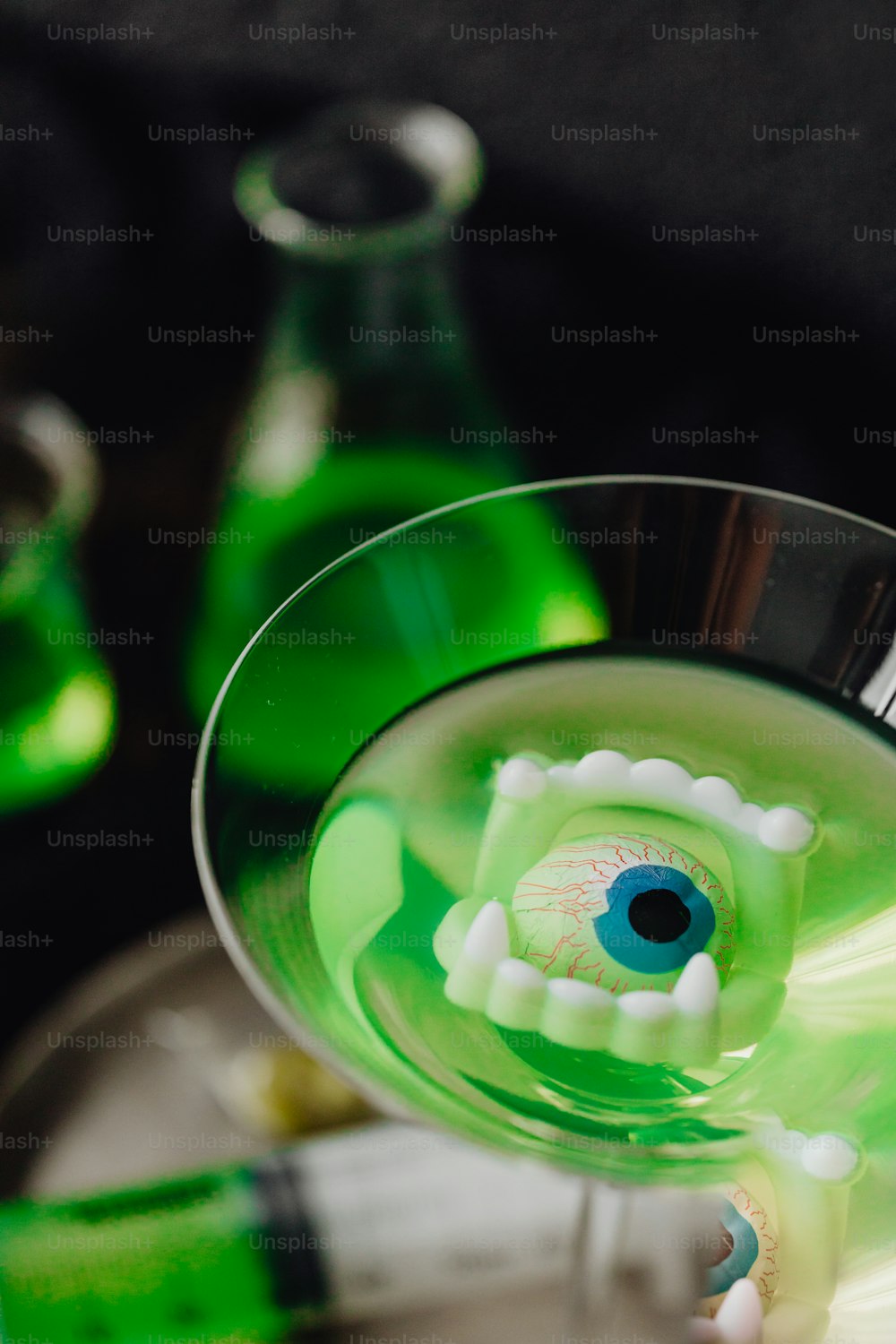 a close up of a green drink in a glass