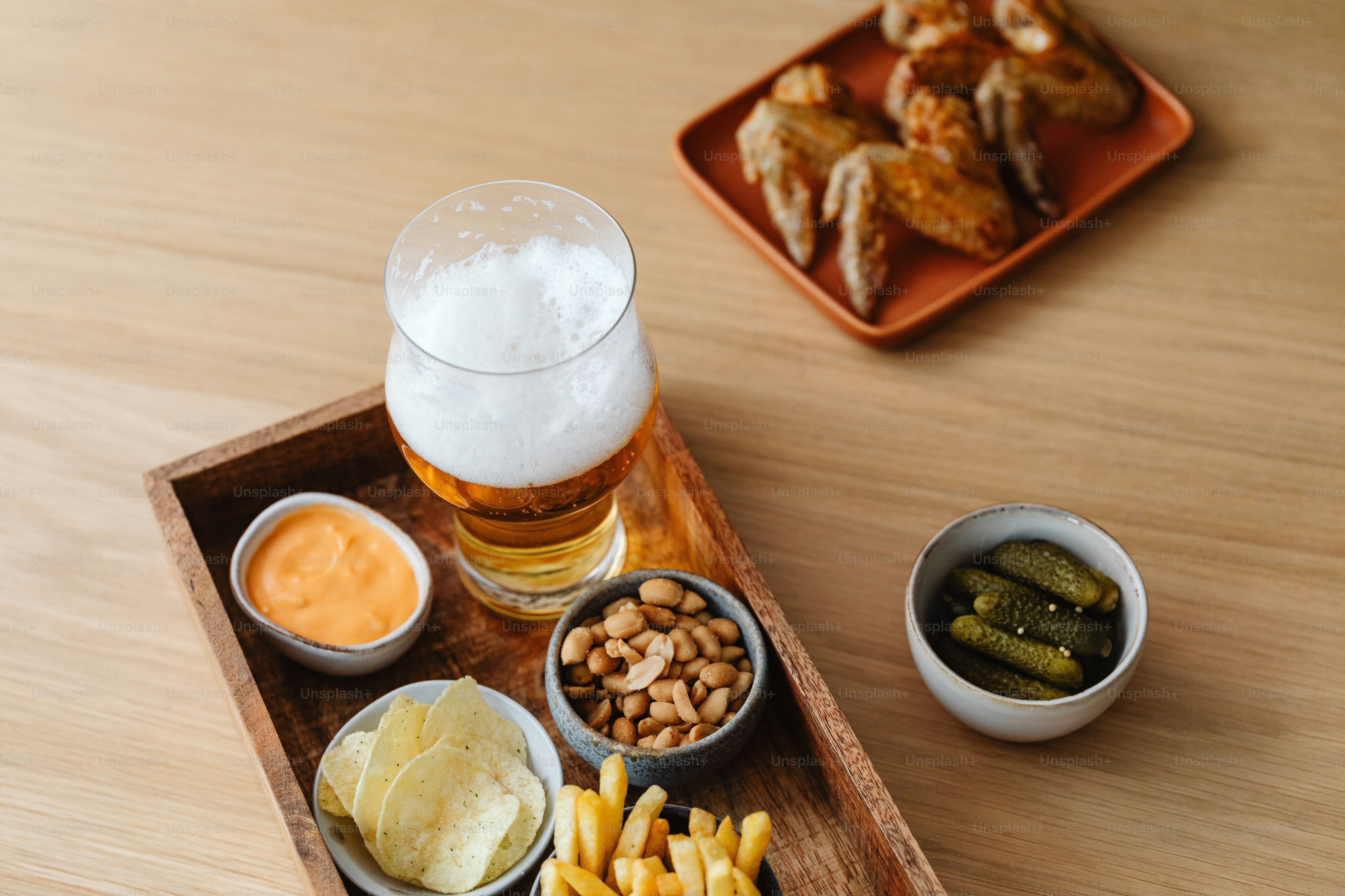 a wooden tray topped with different types of food