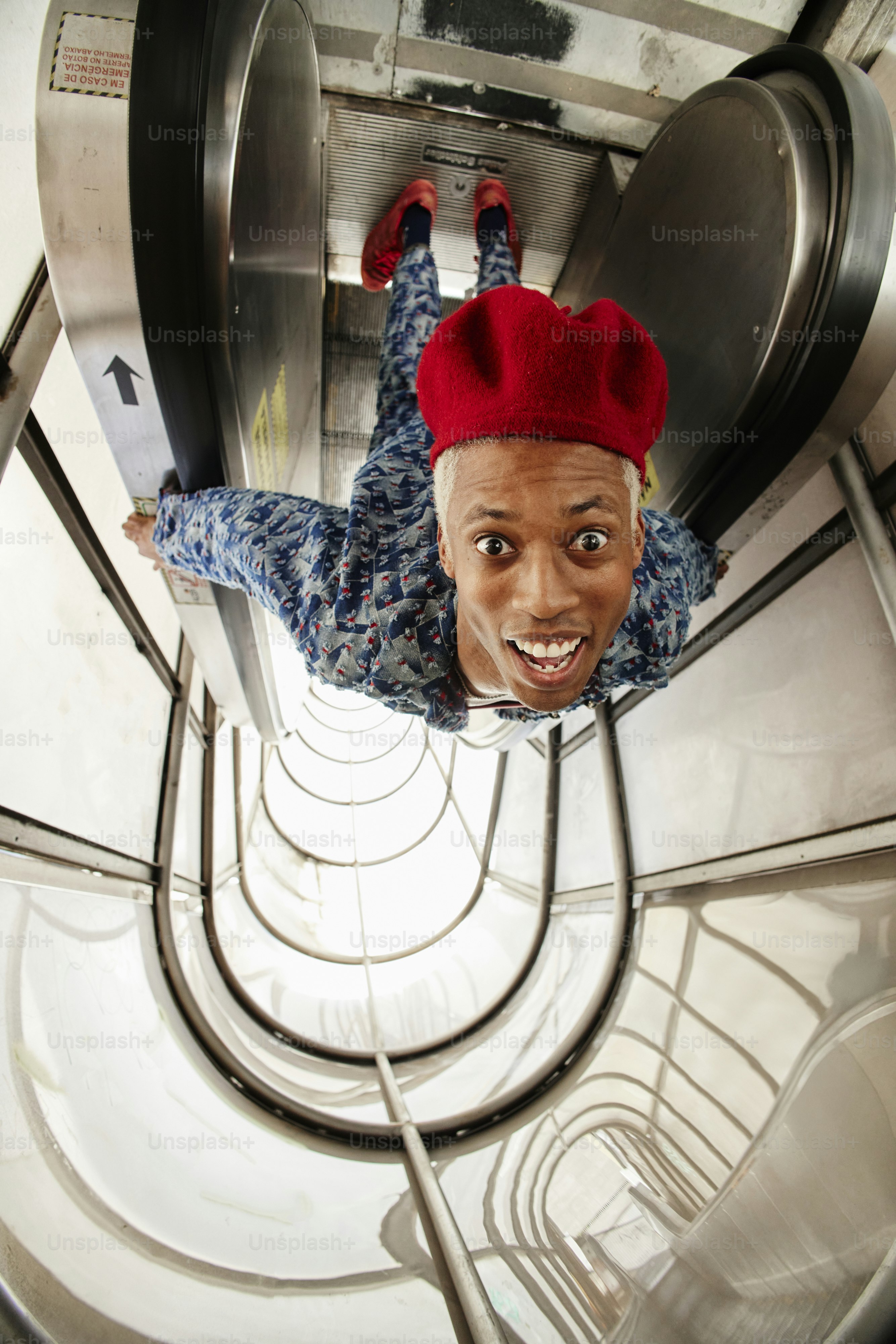 a man in a red hat is upside down