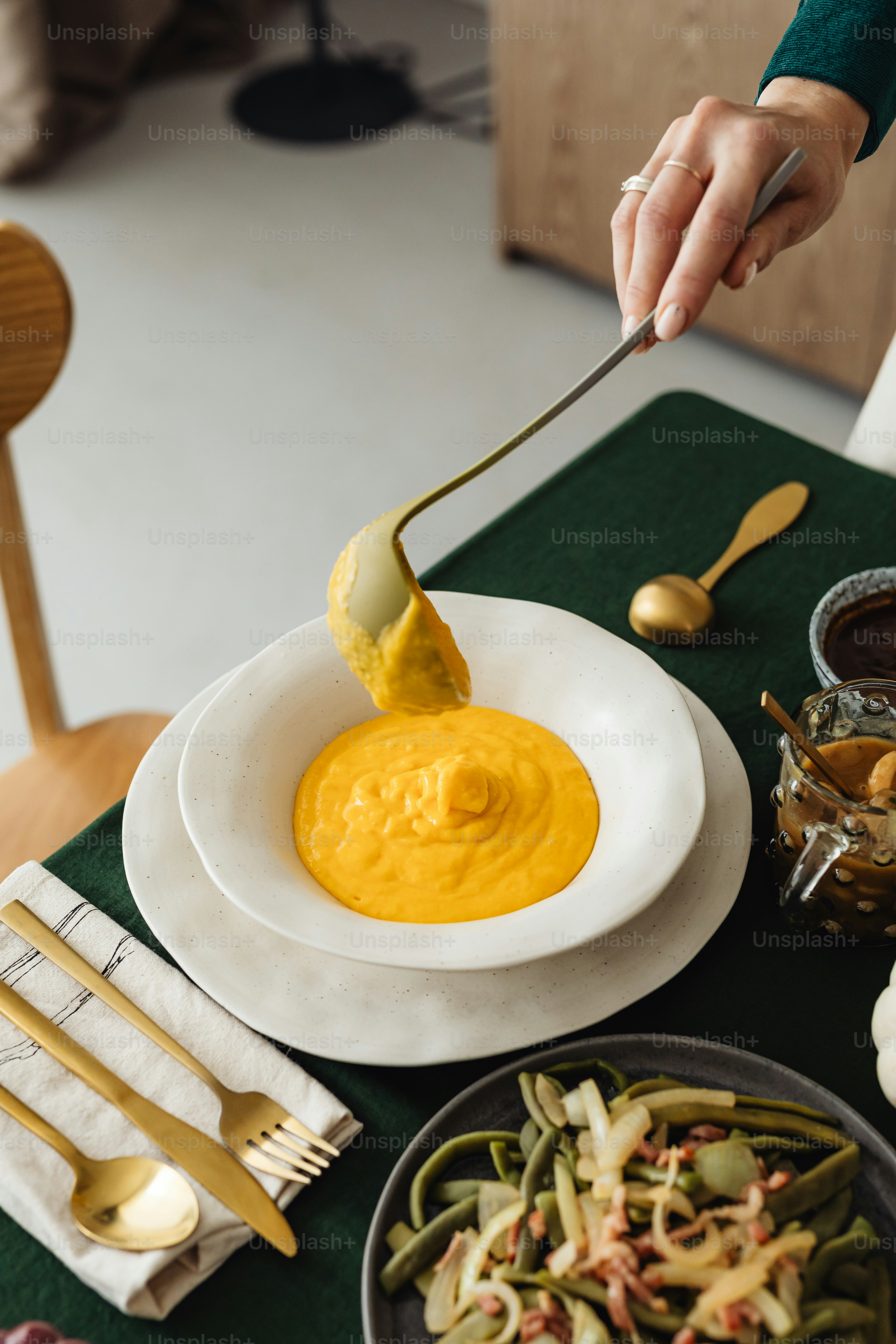 a person is dipping something into a bowl