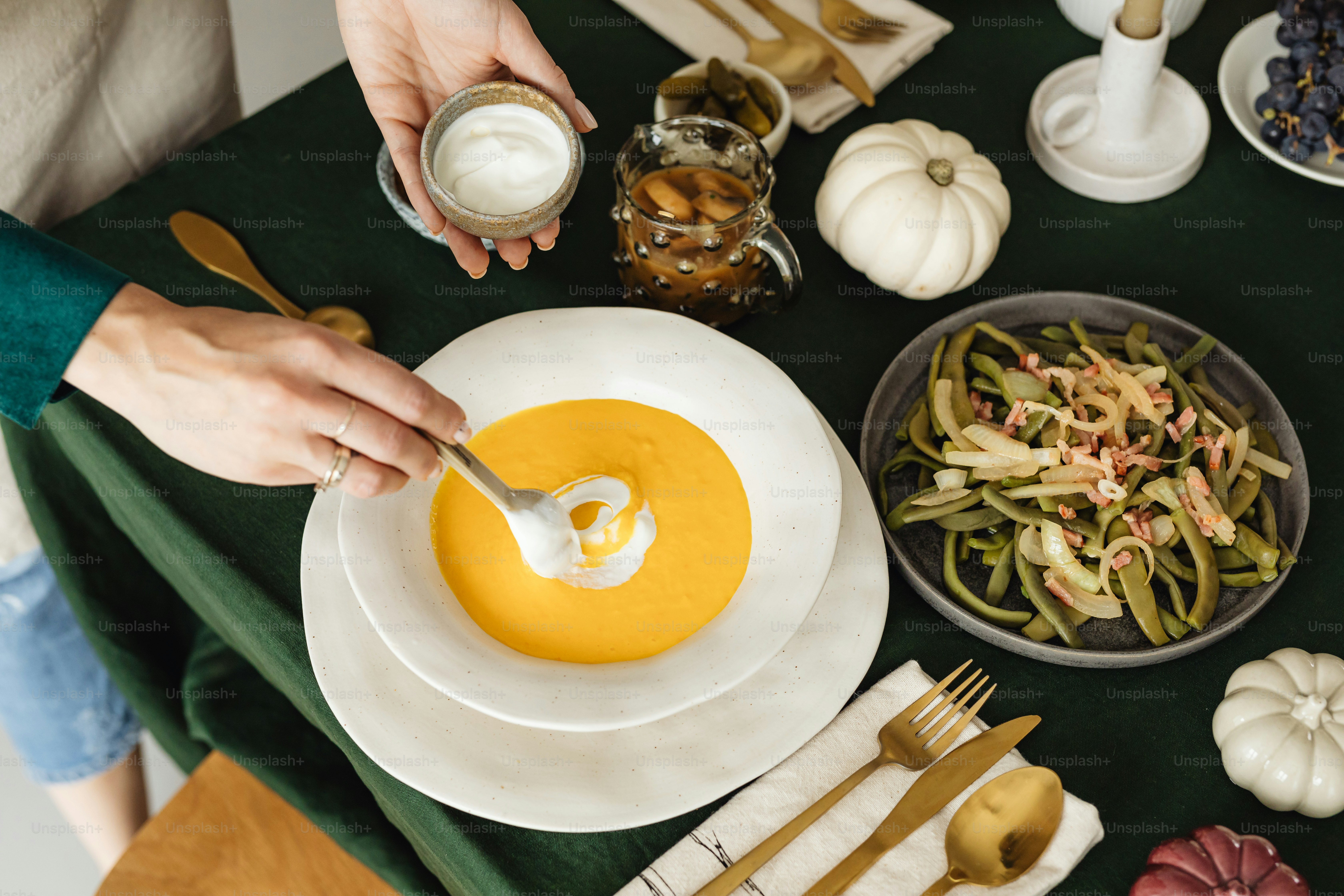 a table topped with plates and bowls of food