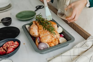 a person holding a fork over a tray of food