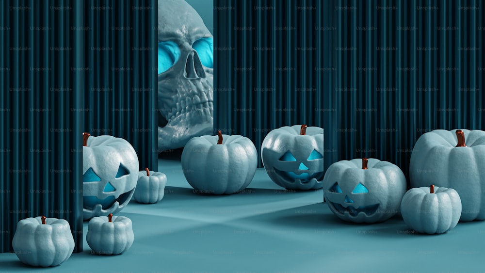 a group of pumpkins sitting on top of a blue floor