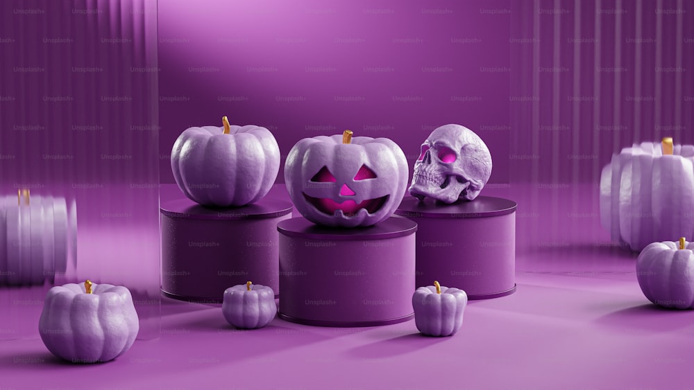 a group of pumpkins sitting on top of a purple table