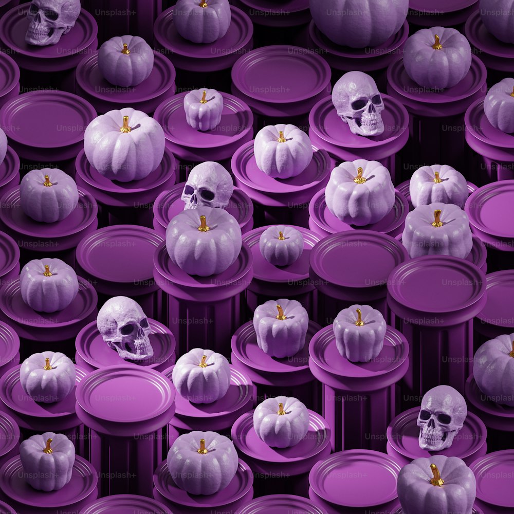 a bunch of purple plates with skulls on them