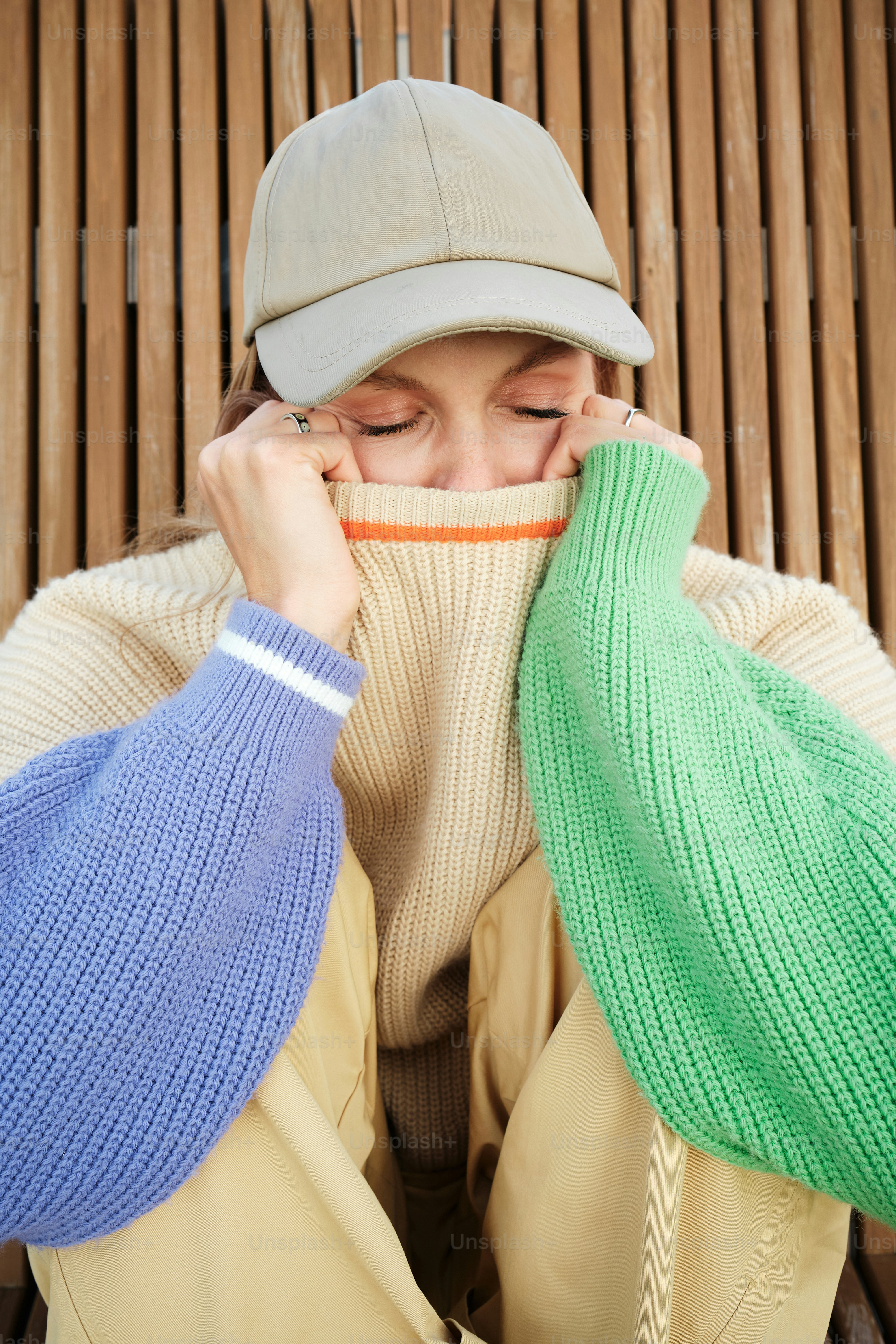 a woman covers her face with her hands