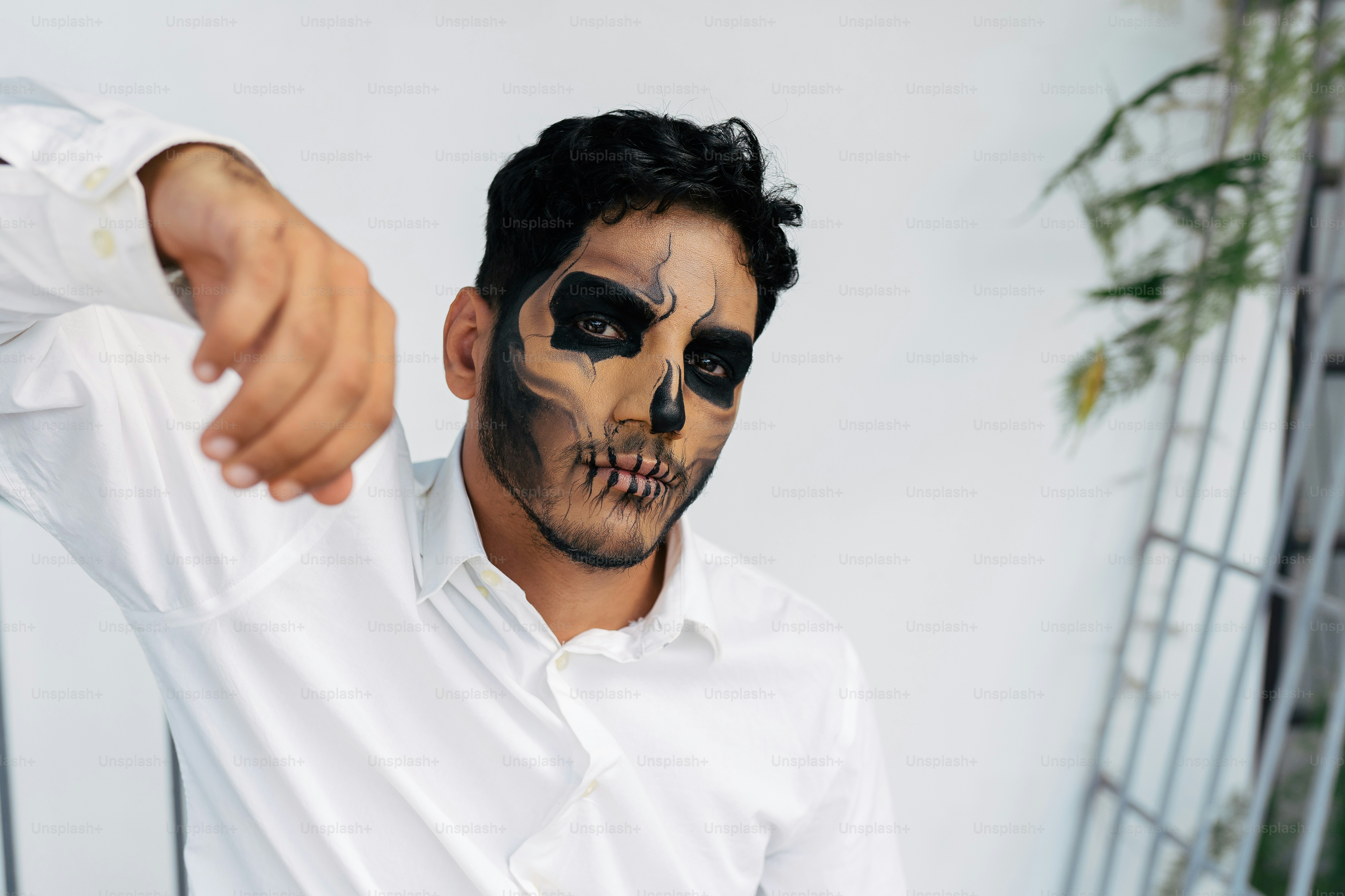 a man with a painted skull on his face
