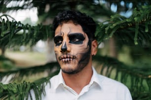 a man with a face painted like a skeleton