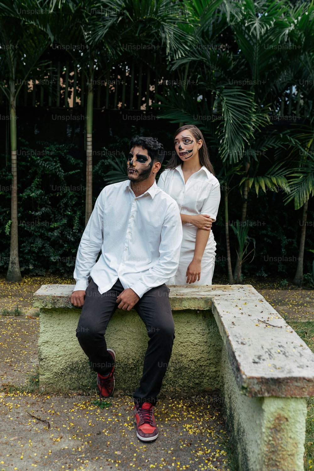 a man and a woman are sitting on a bench
