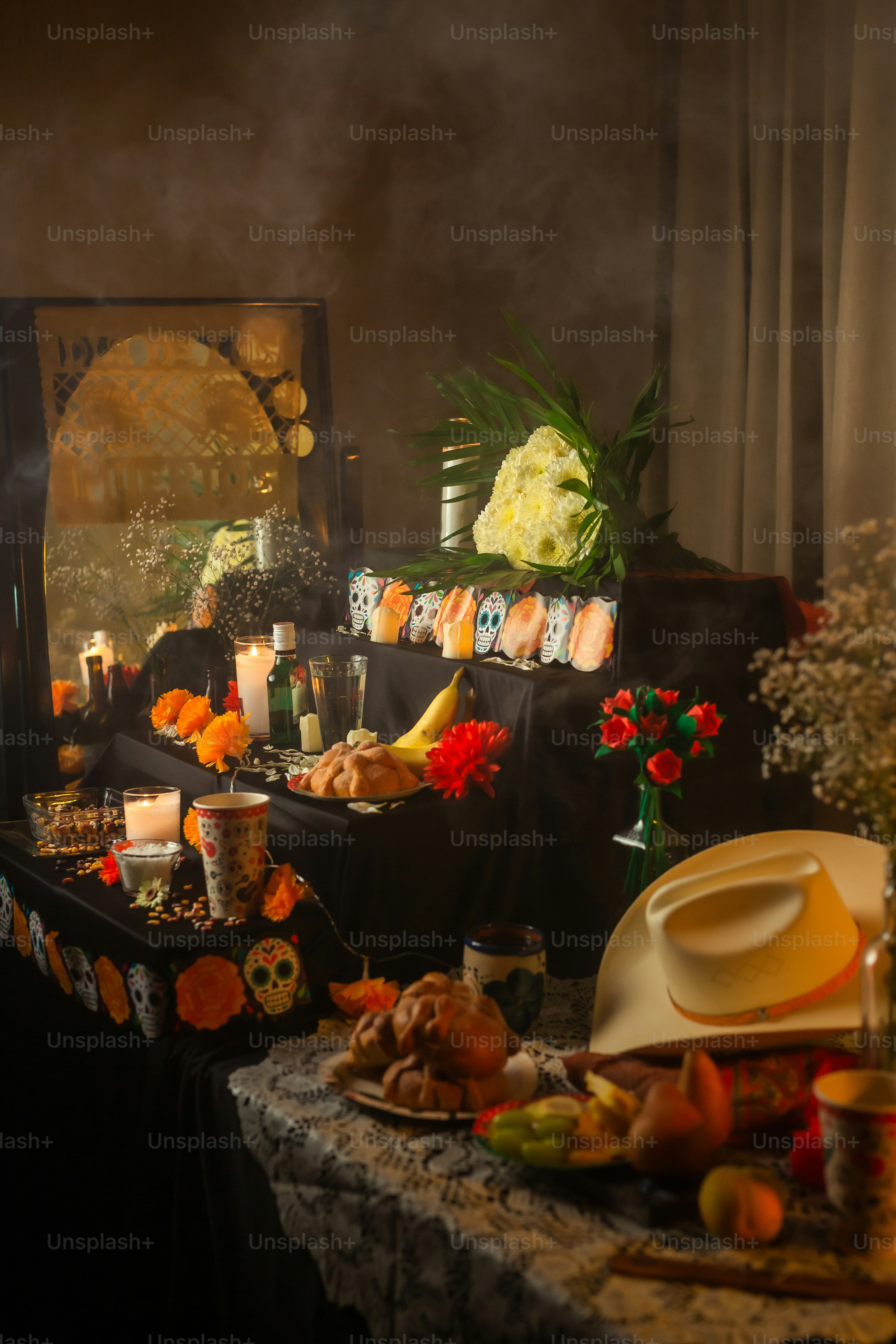 a table topped with lots of food and candles