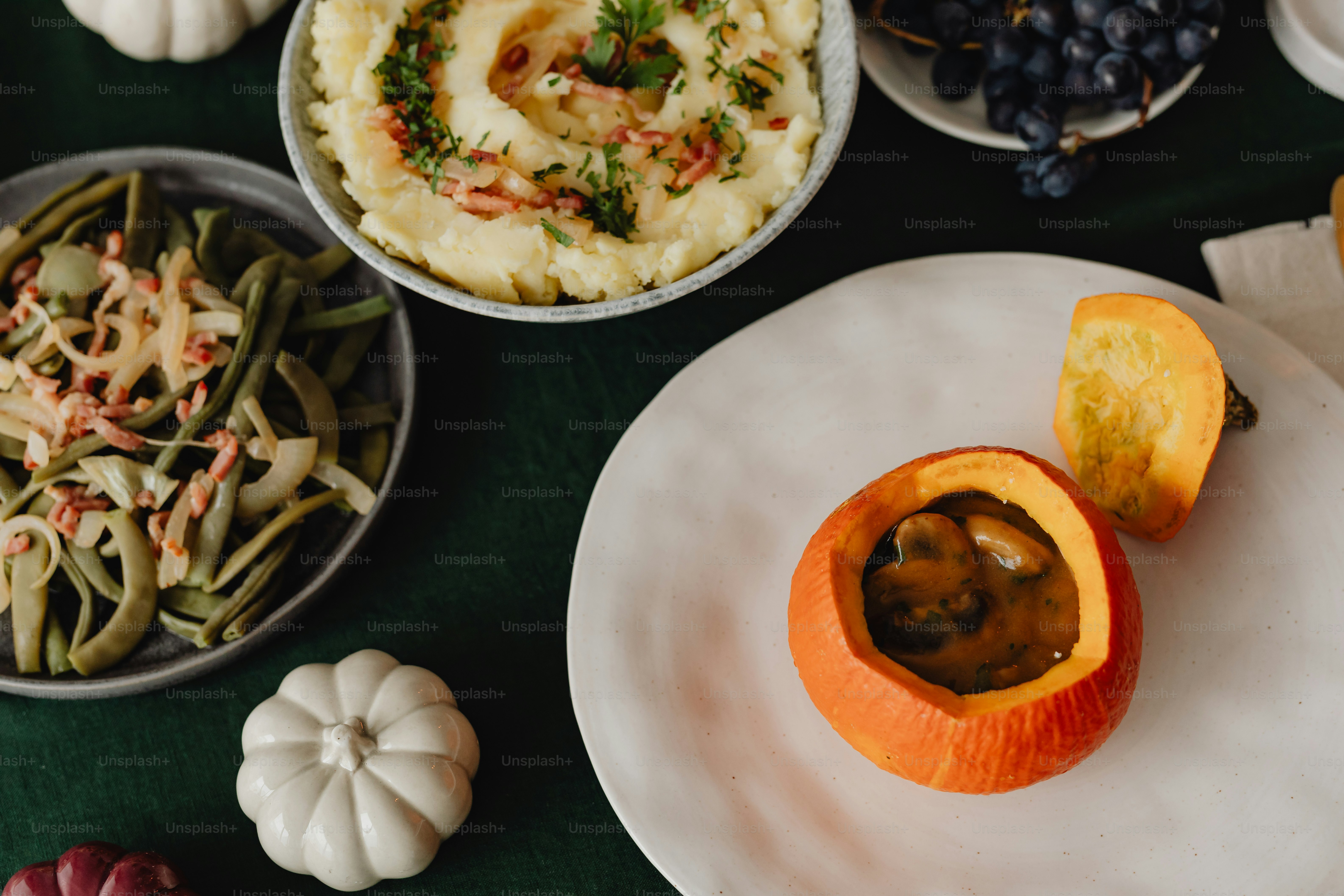 a table topped with plates and bowls of food