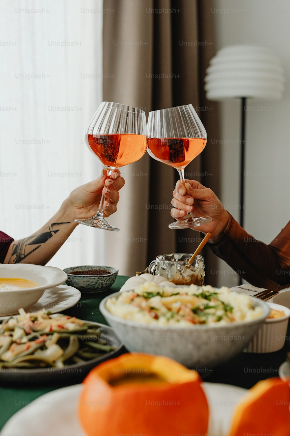 a couple of people that are holding wine glasses