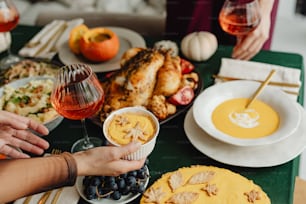 a table filled with plates of food and glasses of wine