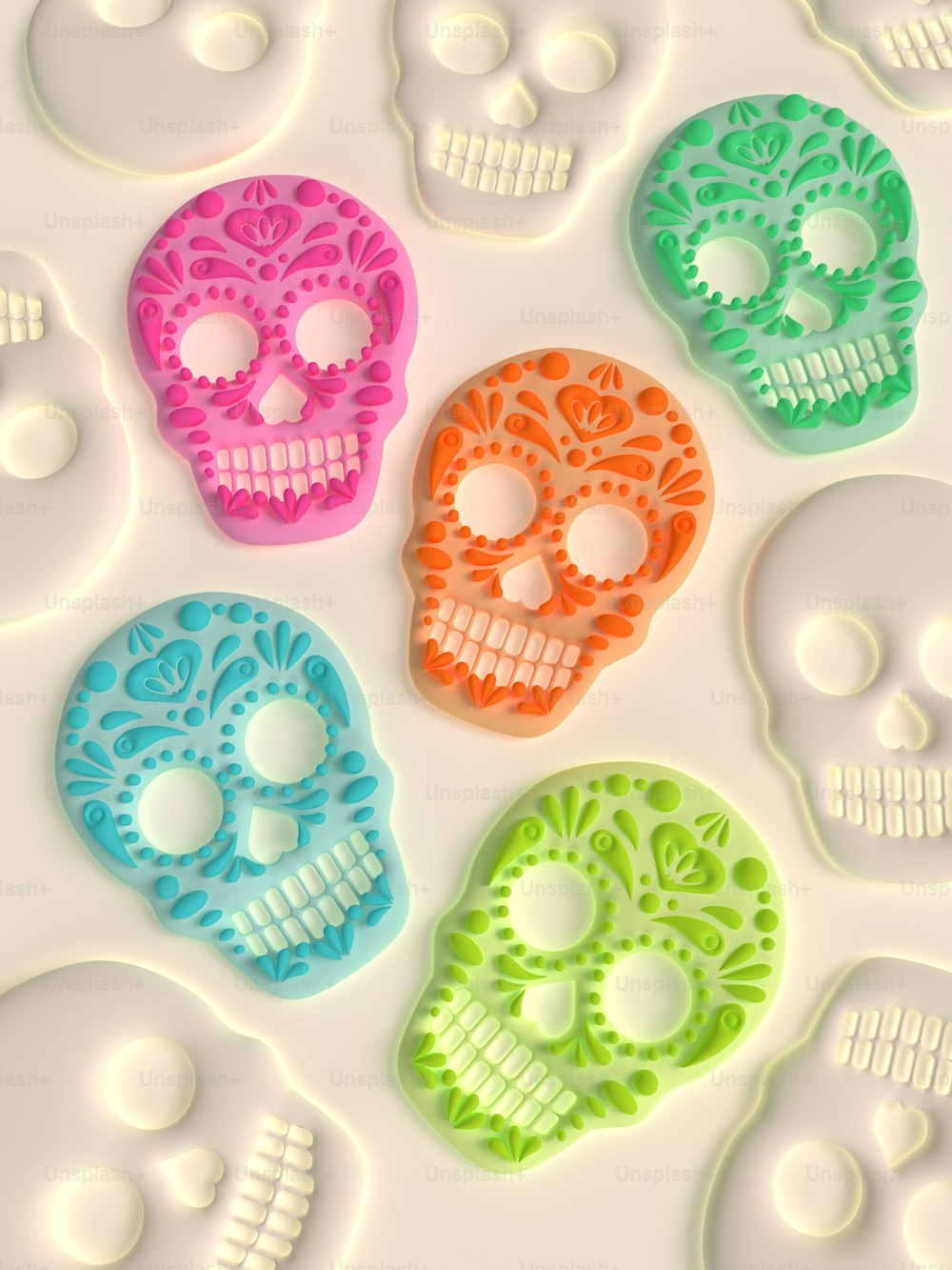 a group of colorful skulls sitting on top of a white surface