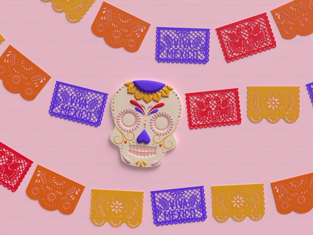a paper cut out of a sugar skull on a pink background