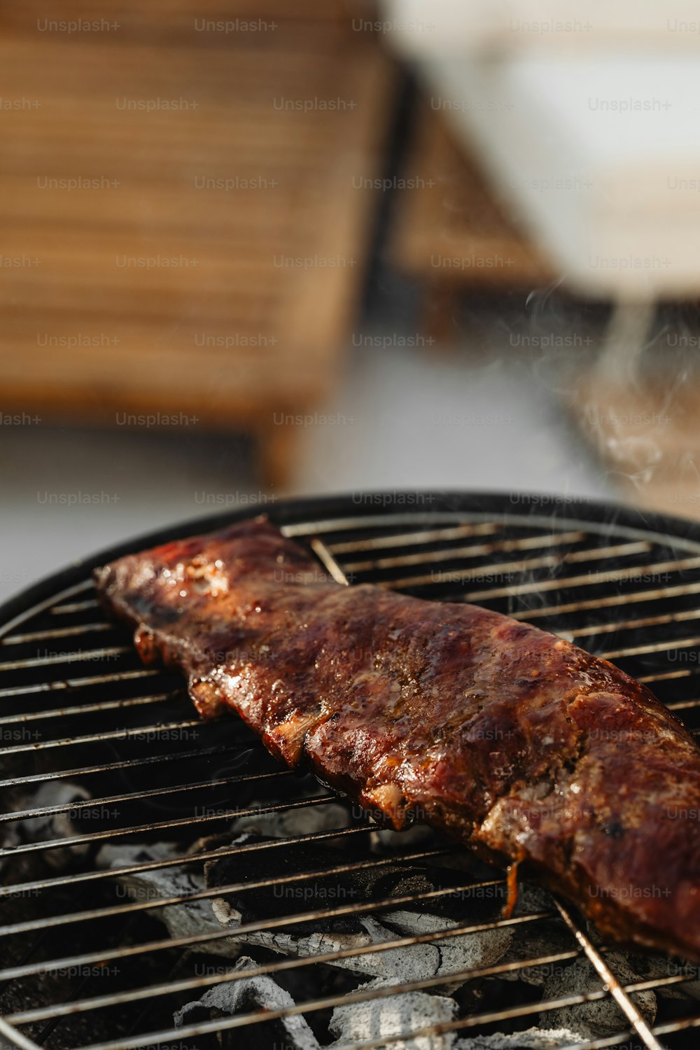 a piece of meat is cooking on a grill
