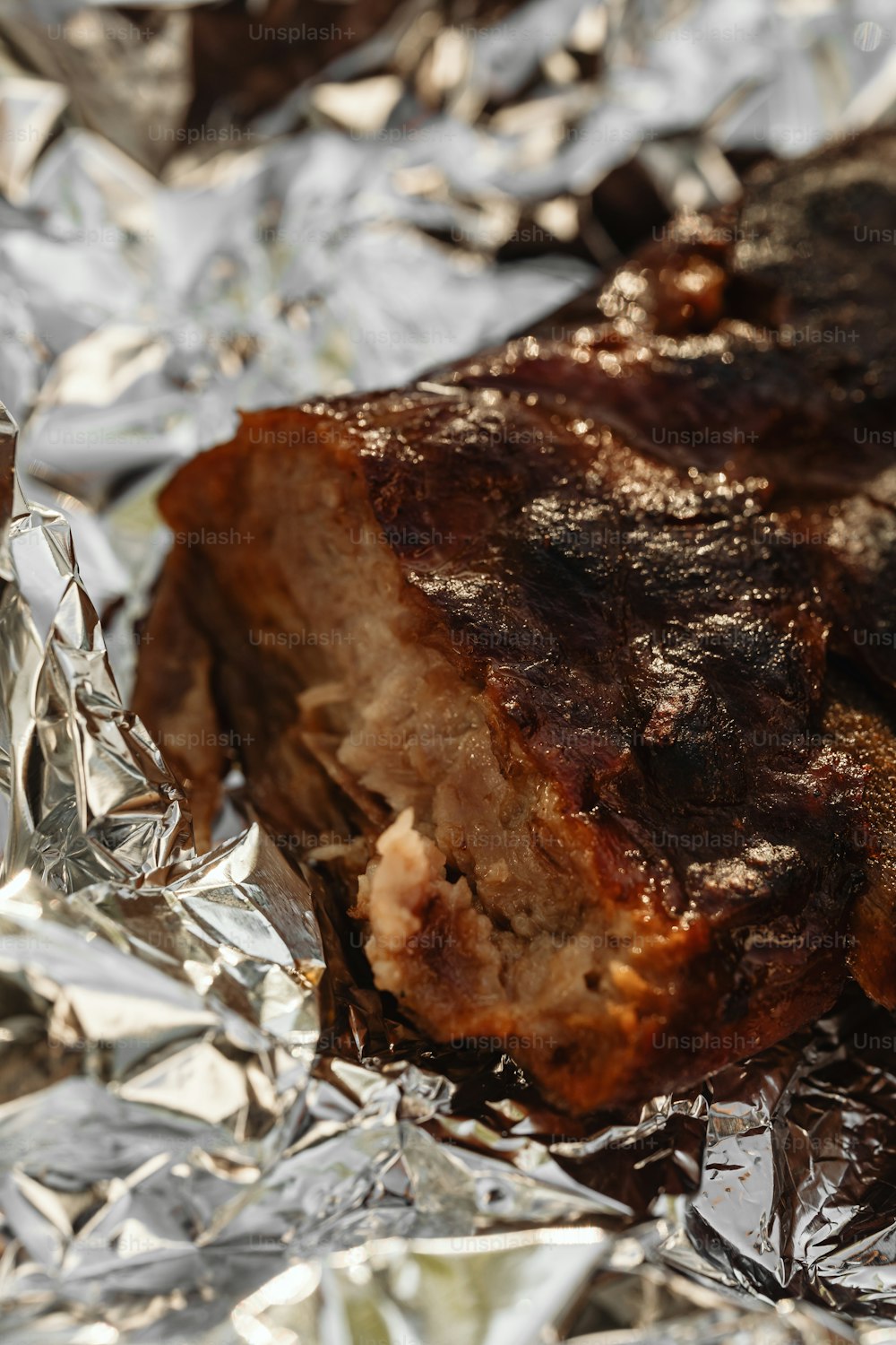 a piece of meat sitting on top of tin foil