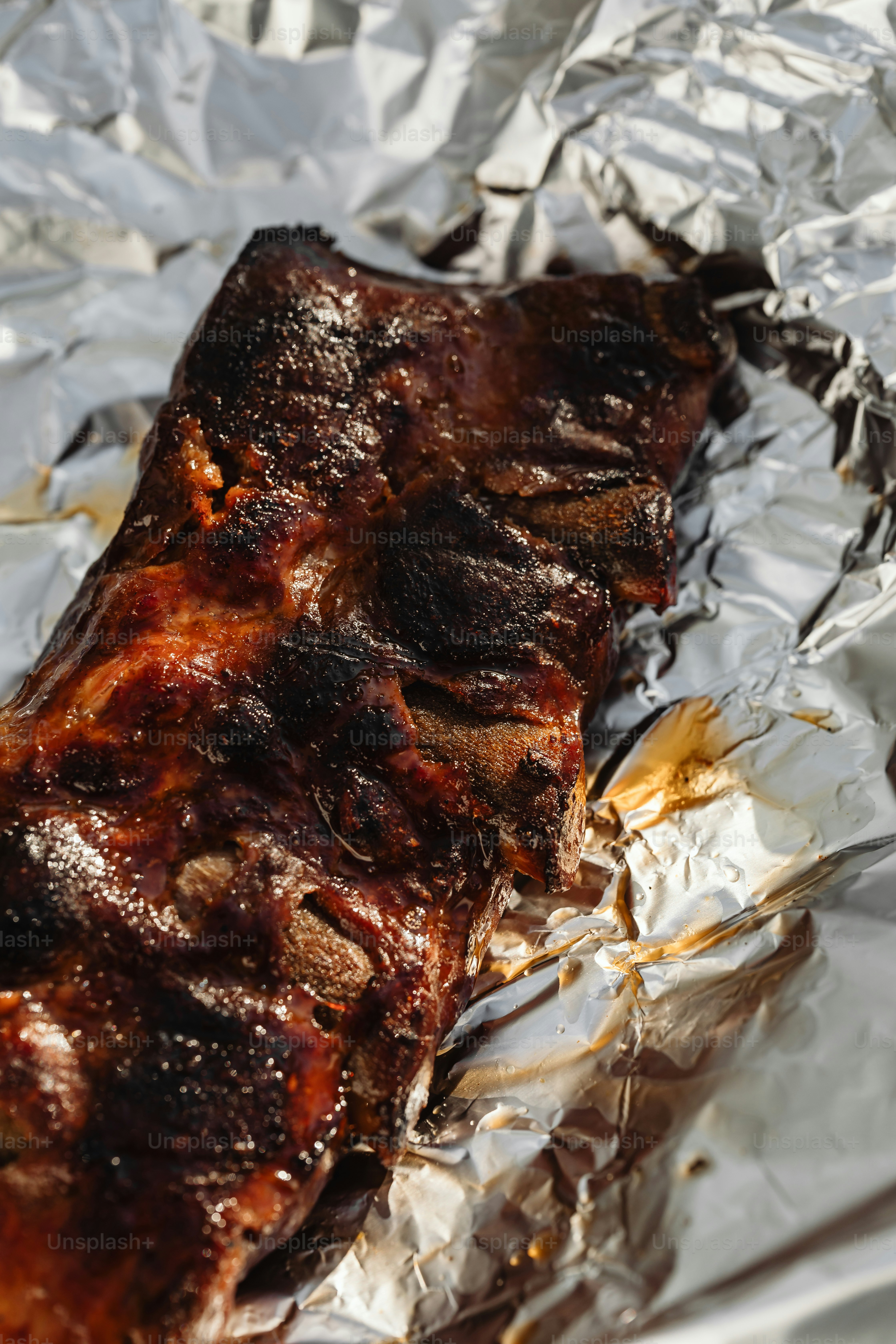 a piece of meat sitting on top of tin foil