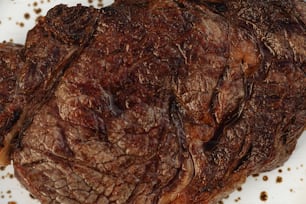 a close up of a steak on a plate