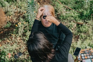 a woman with her face painted in black