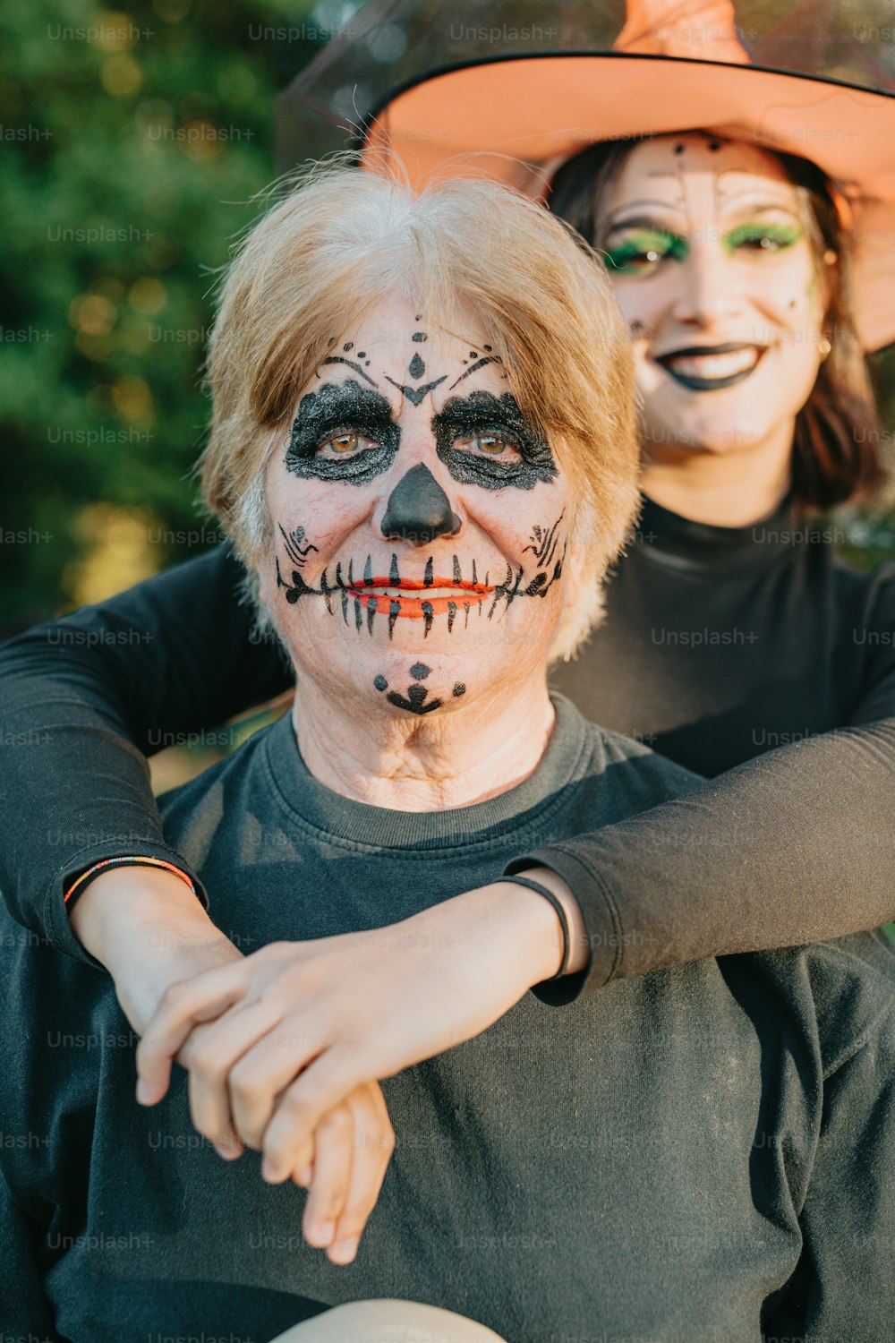 a couple of people that are wearing face paint