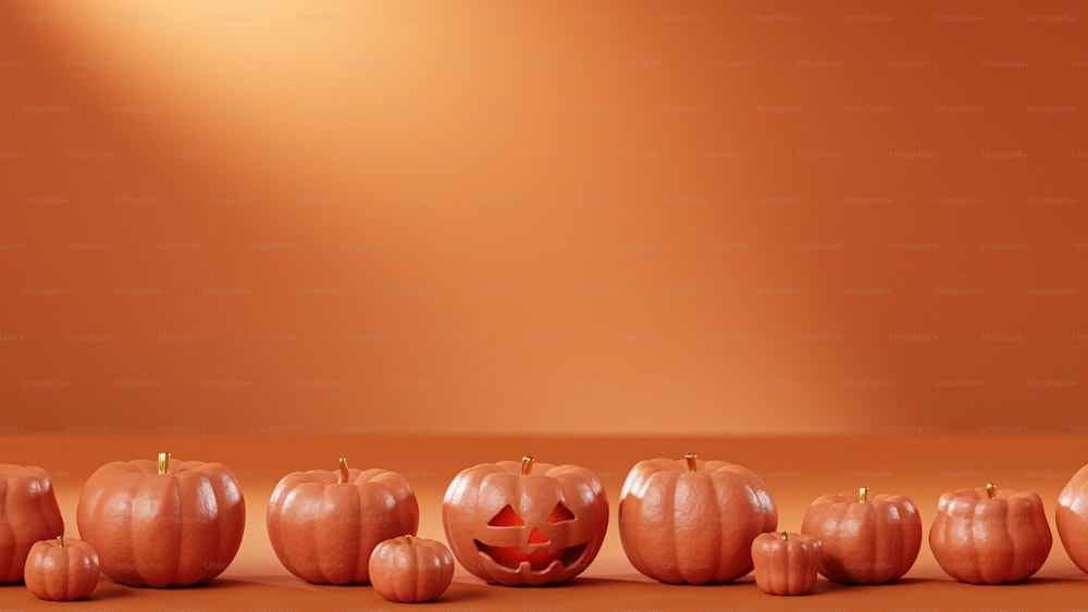 a row of carved pumpkins sitting on top of a table