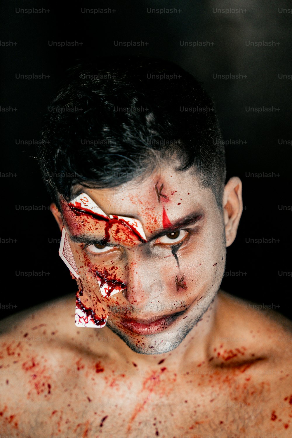 a man with blood all over his face