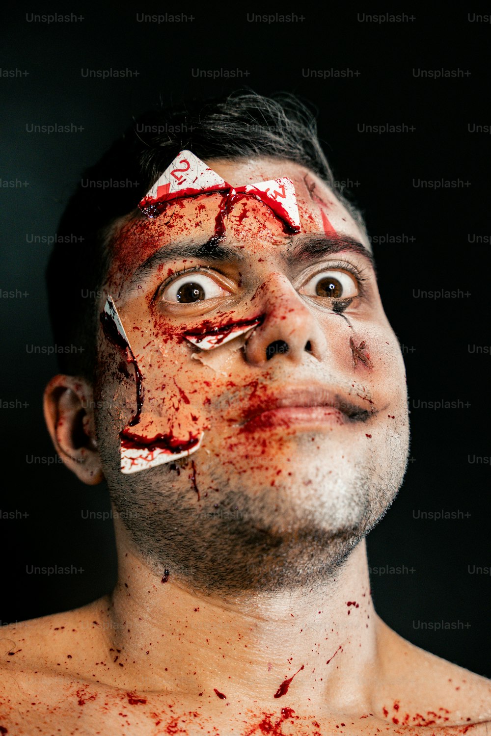 a man with blood all over his face
