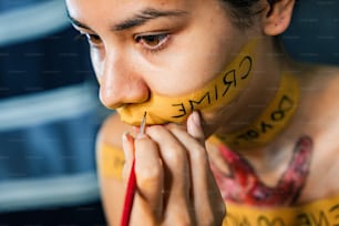 a woman with yellow painted on her face