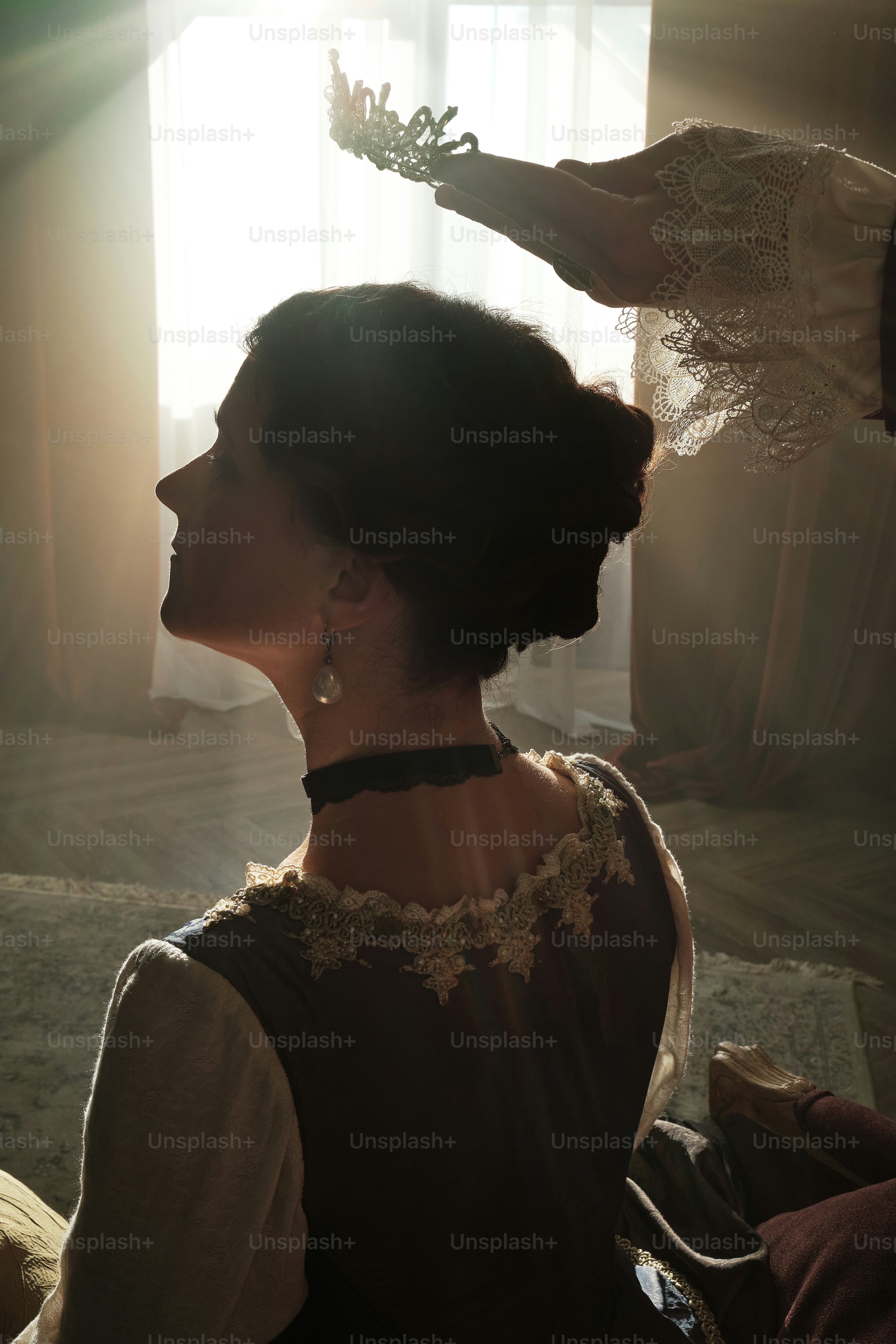 a woman is getting her hair done in a room
