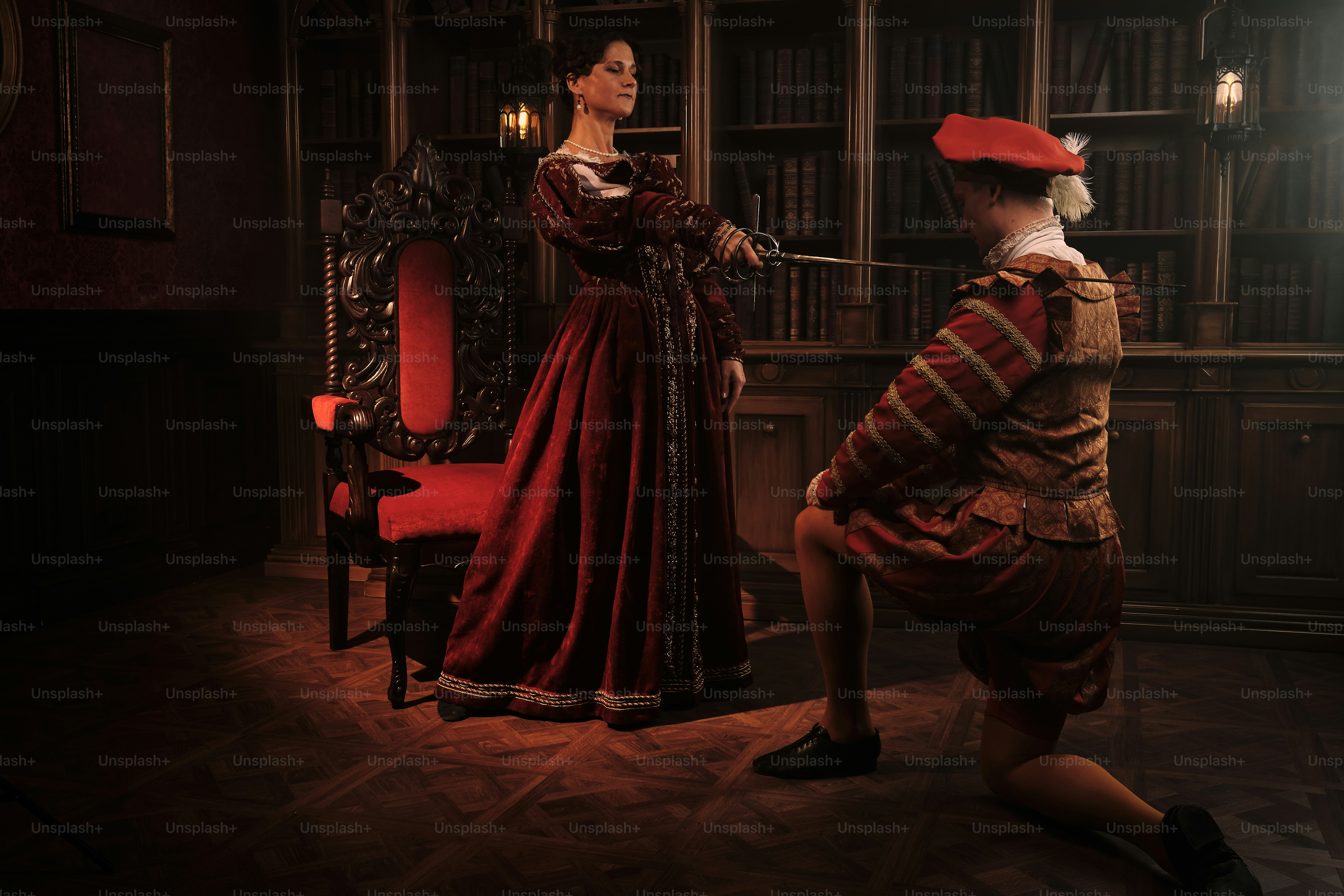 a woman in a red dress and a man in a red hat
