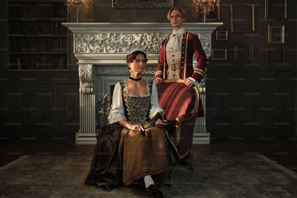 a man and a woman dressed in period clothing