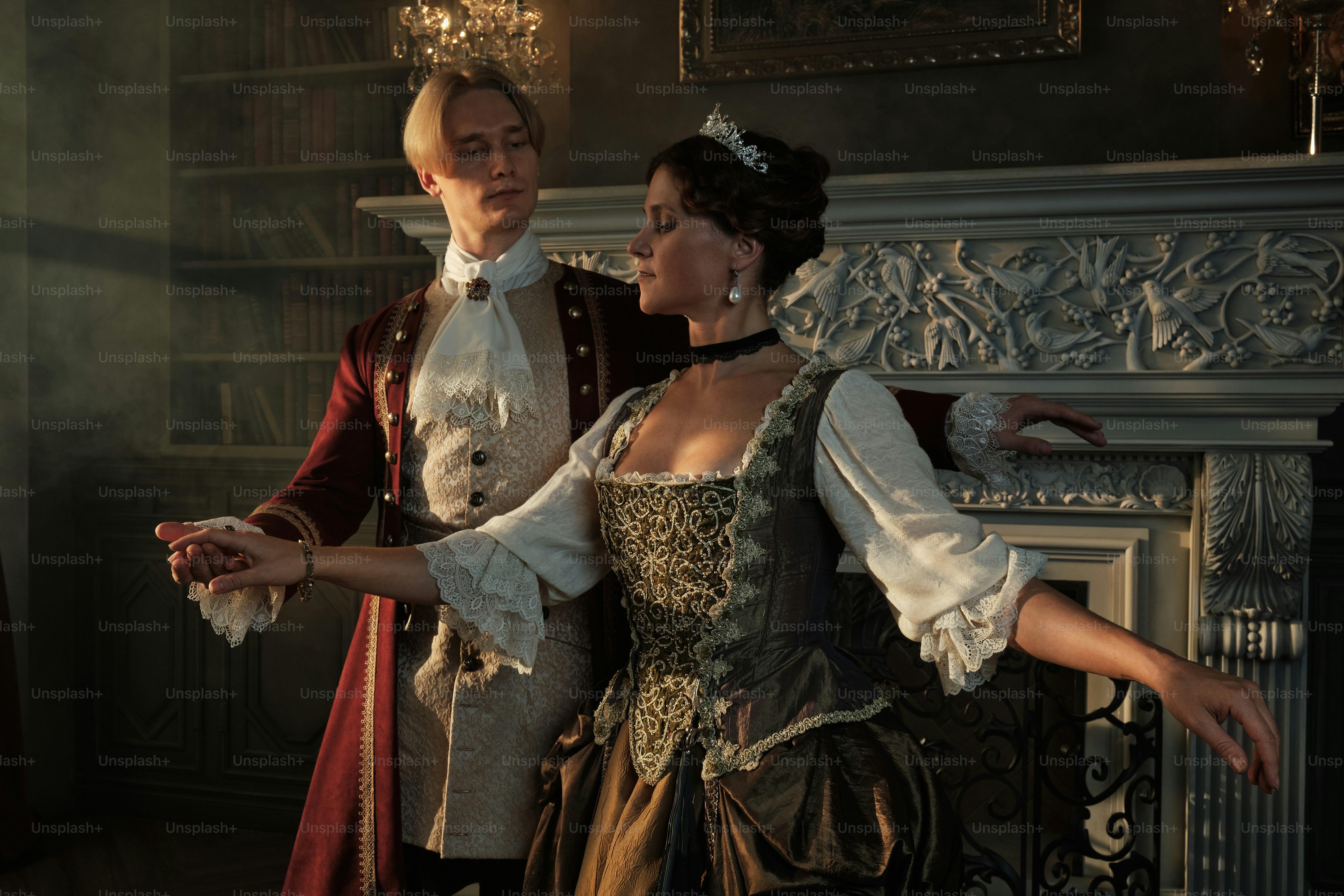 a man and a woman dressed in period costumes