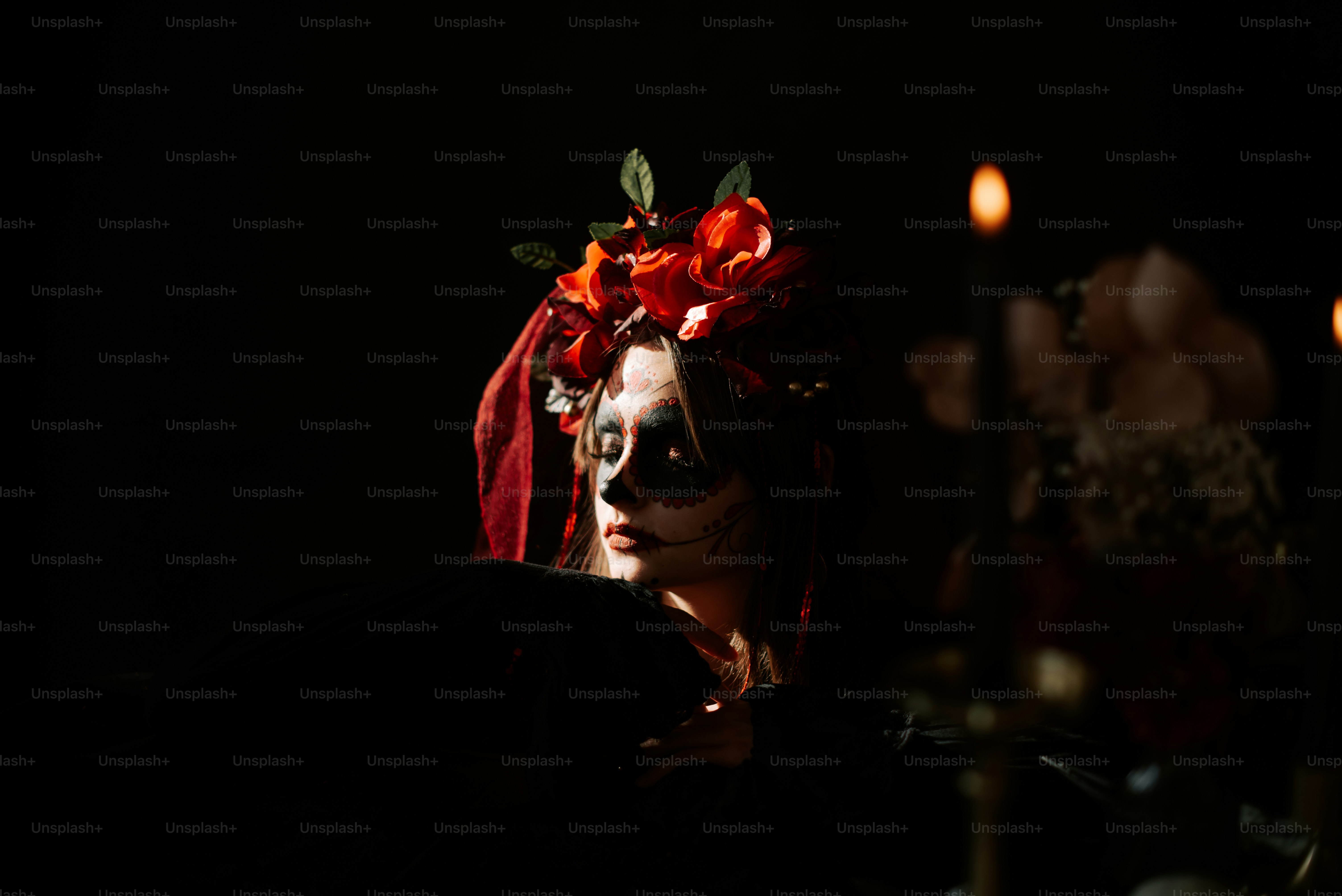 a woman wearing a red veil and flowers in her hair