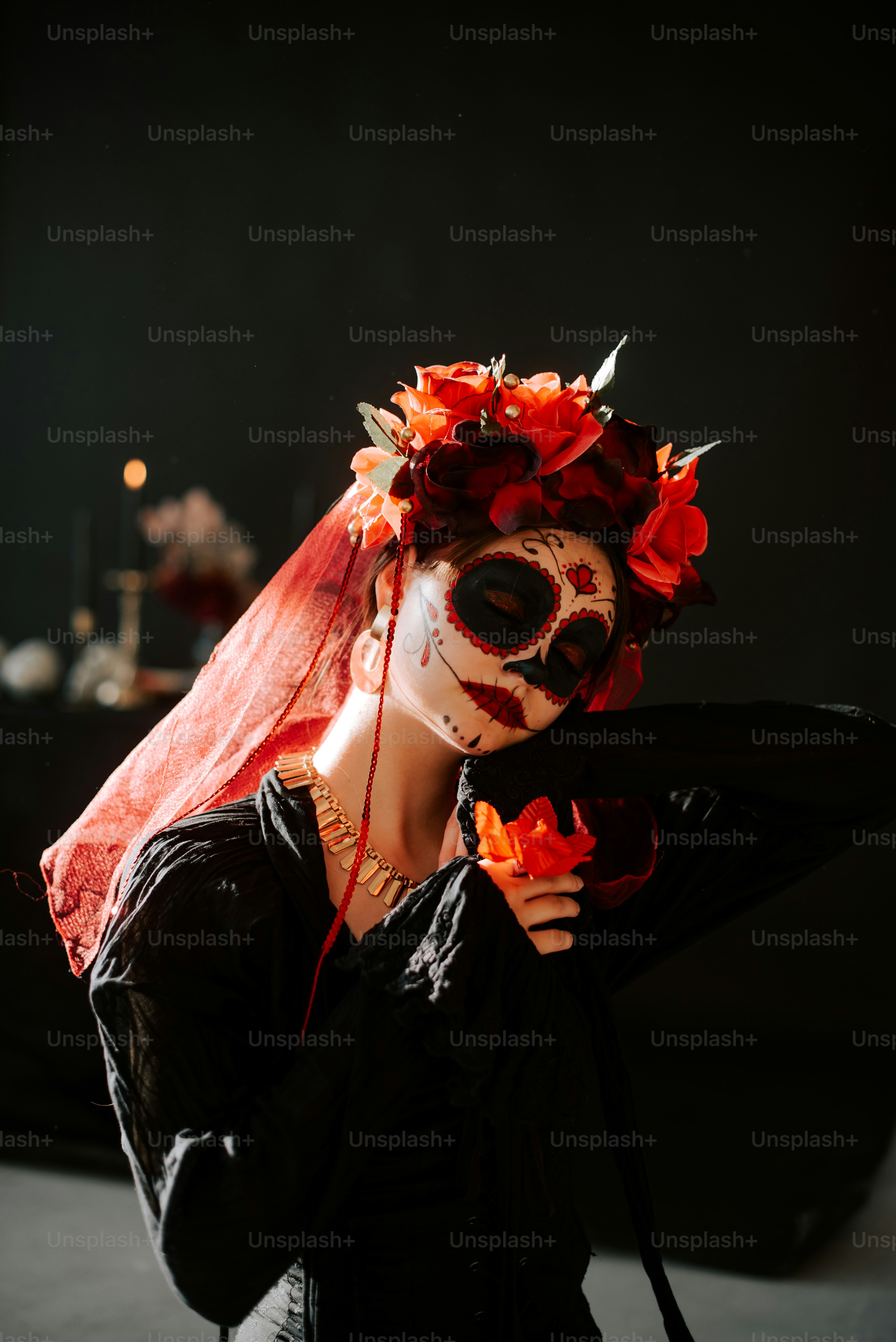 a woman wearing a mask with flowers on her head