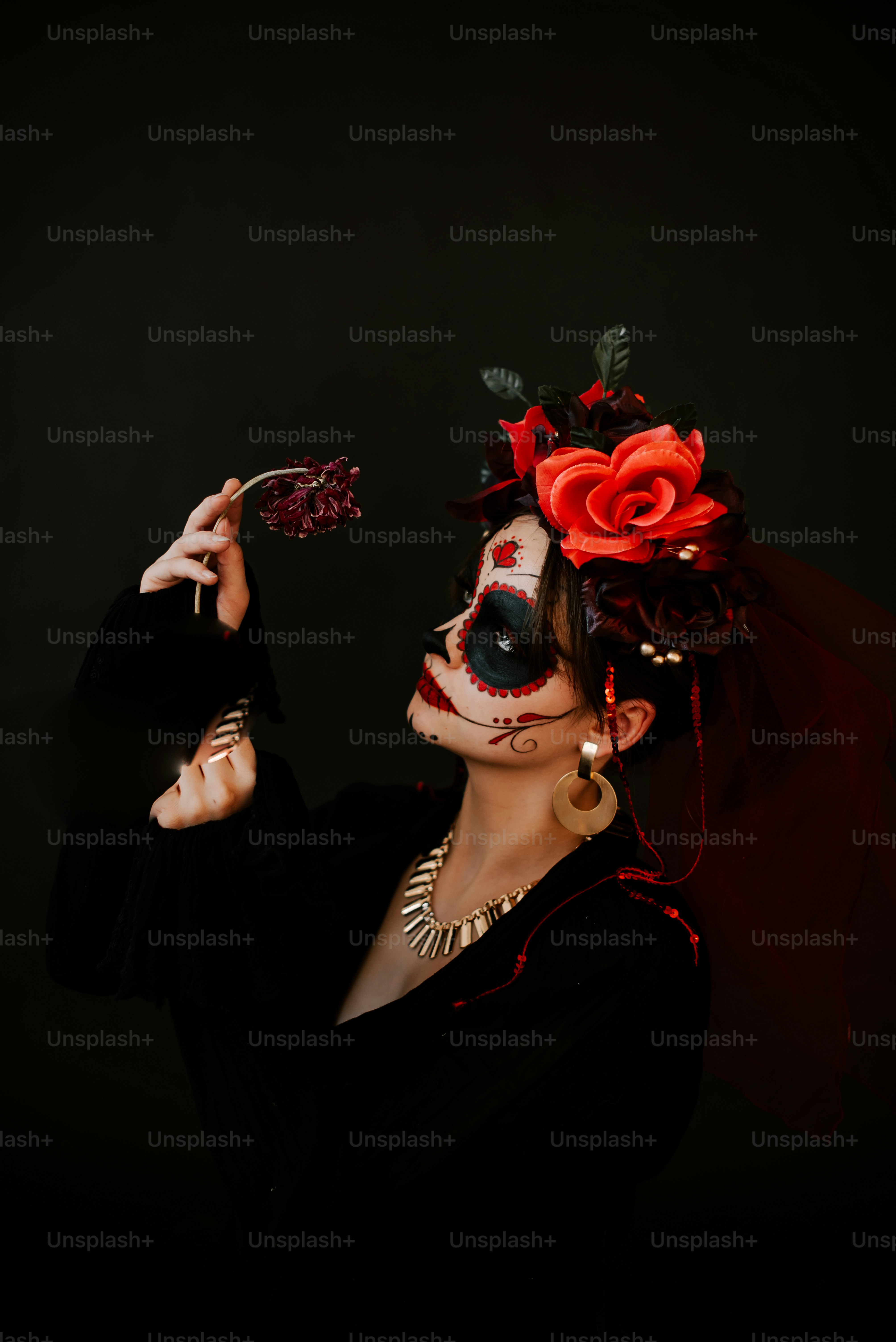 a woman wearing a mask and holding a knife