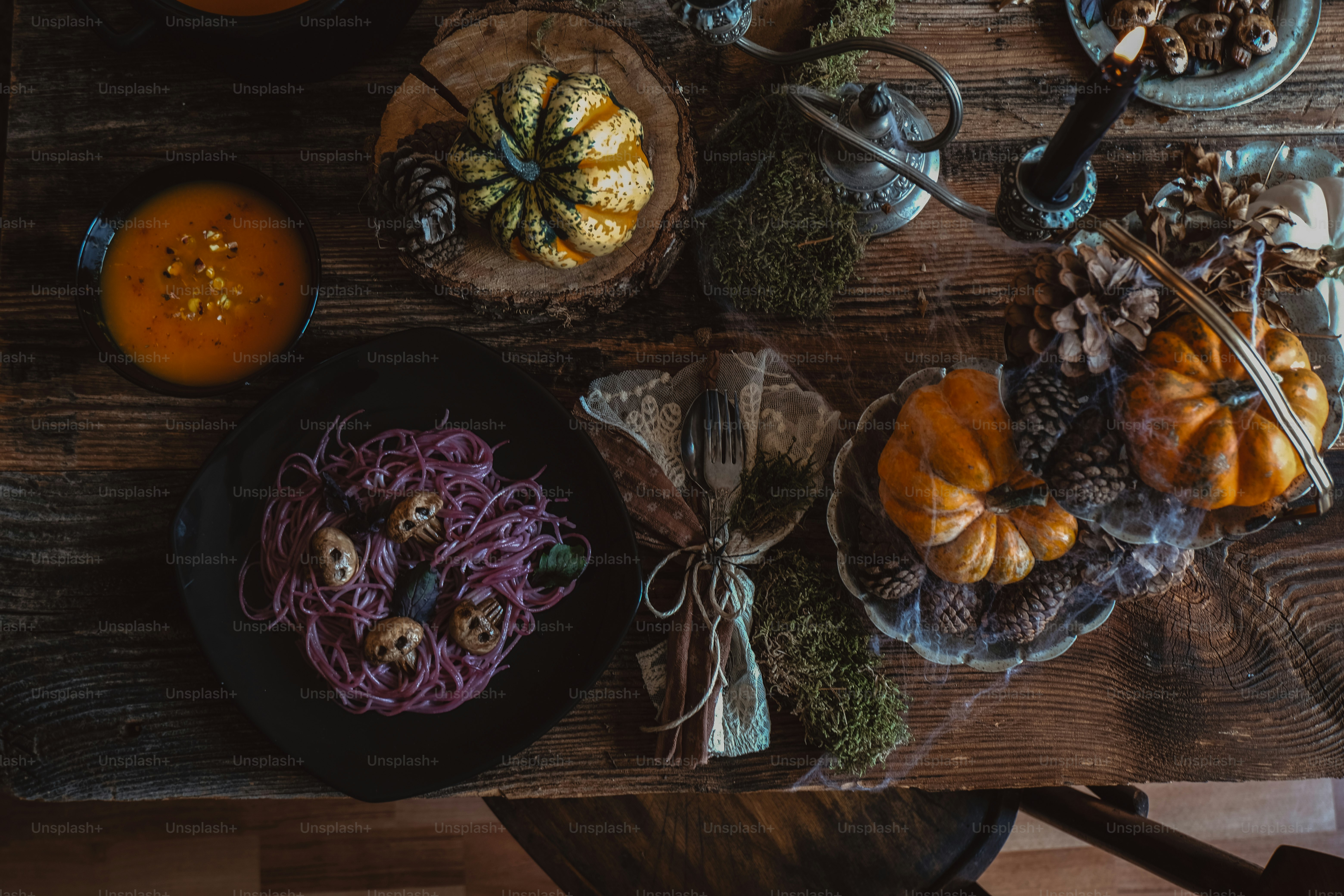a wooden table topped with plates of food