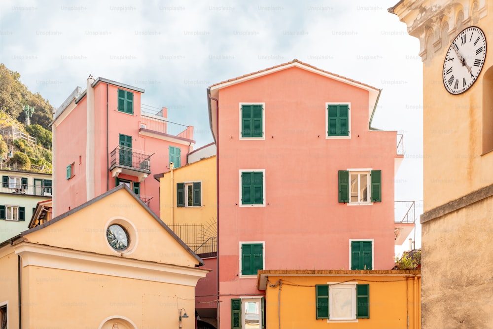 a group of buildings with a clock on the top