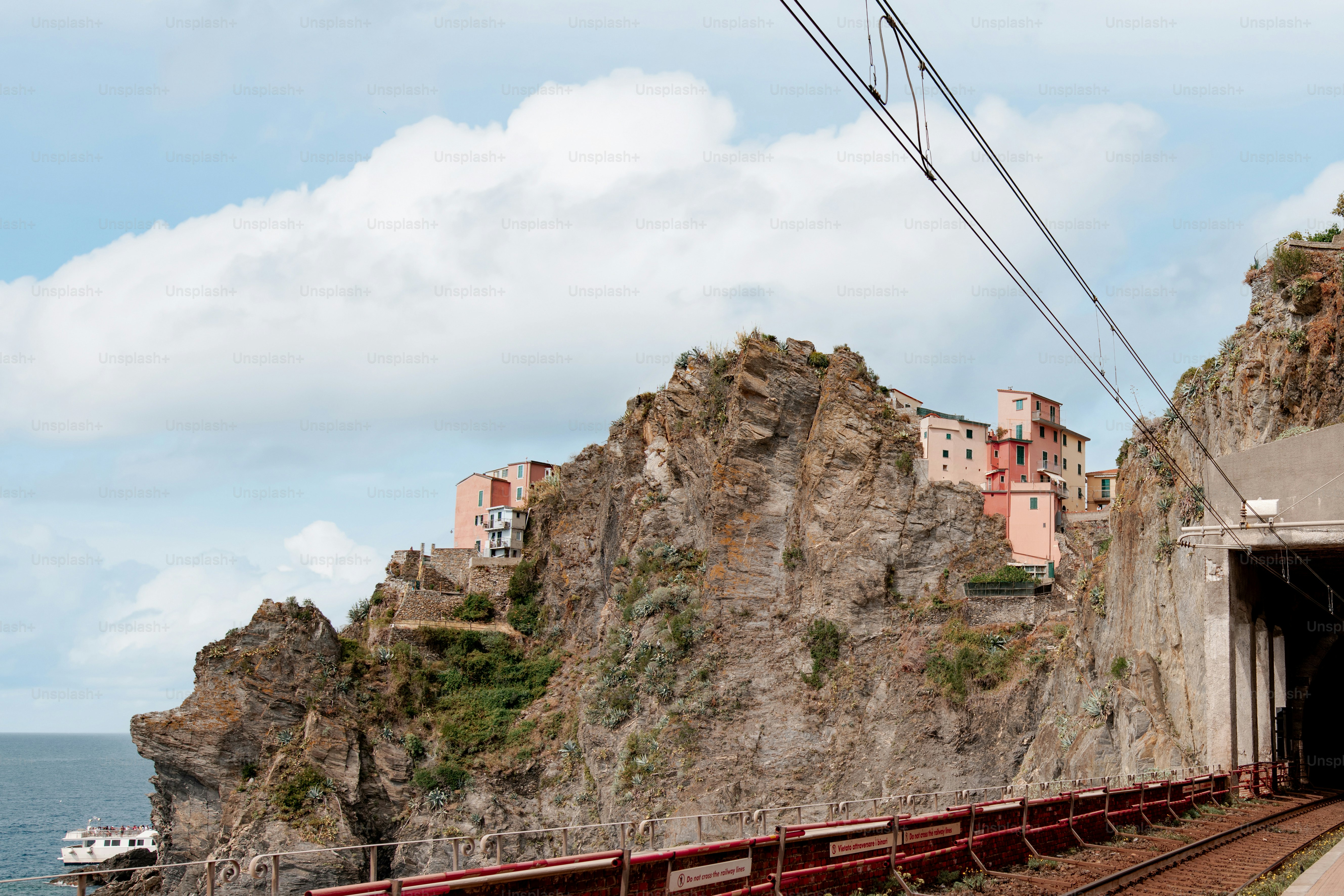 a train going through a tunnel next to a mountain