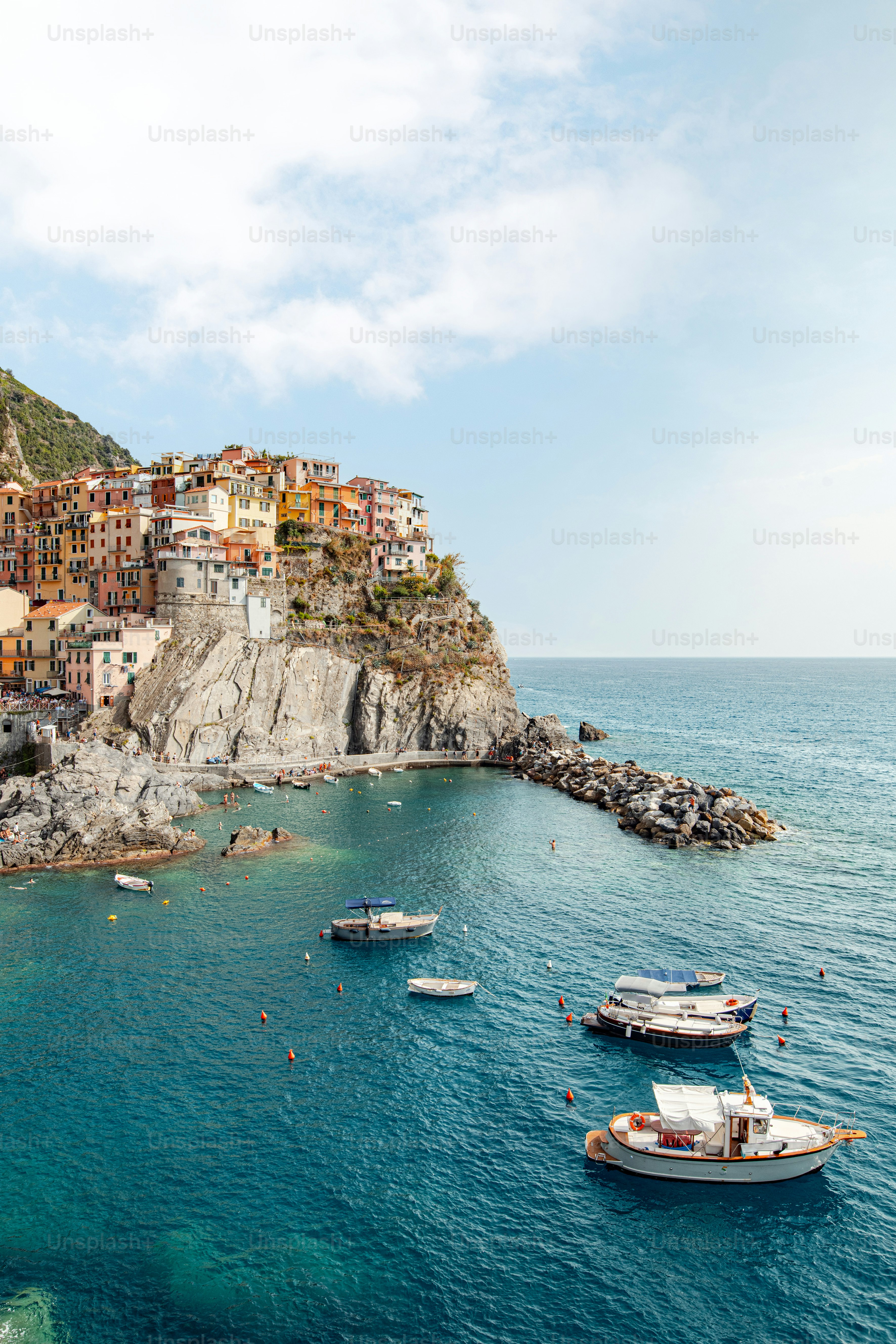 a group of boats floating on top of a body of water