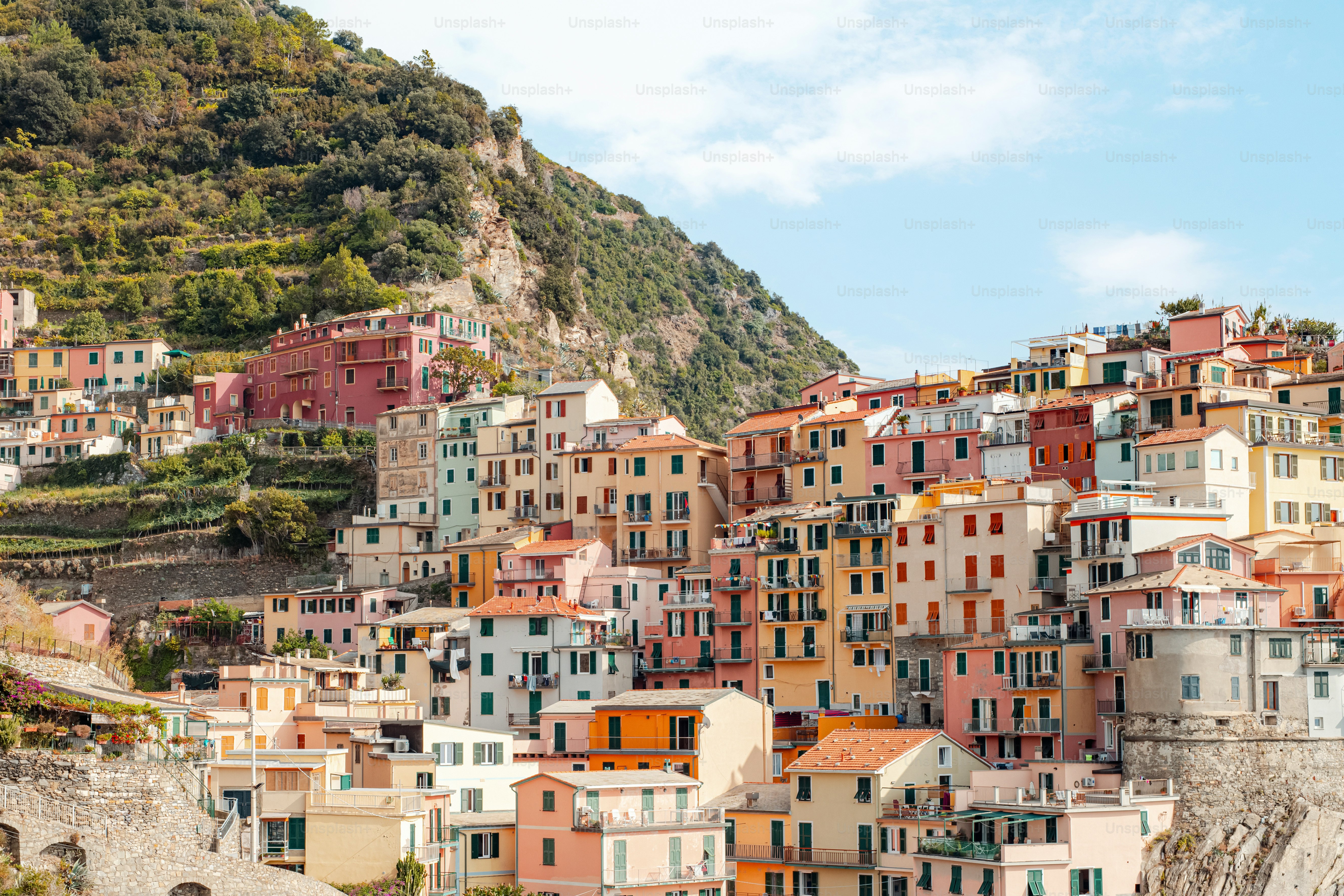 a large group of buildings on the side of a hill