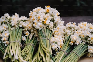 a bunch of flowers that are sitting on a table