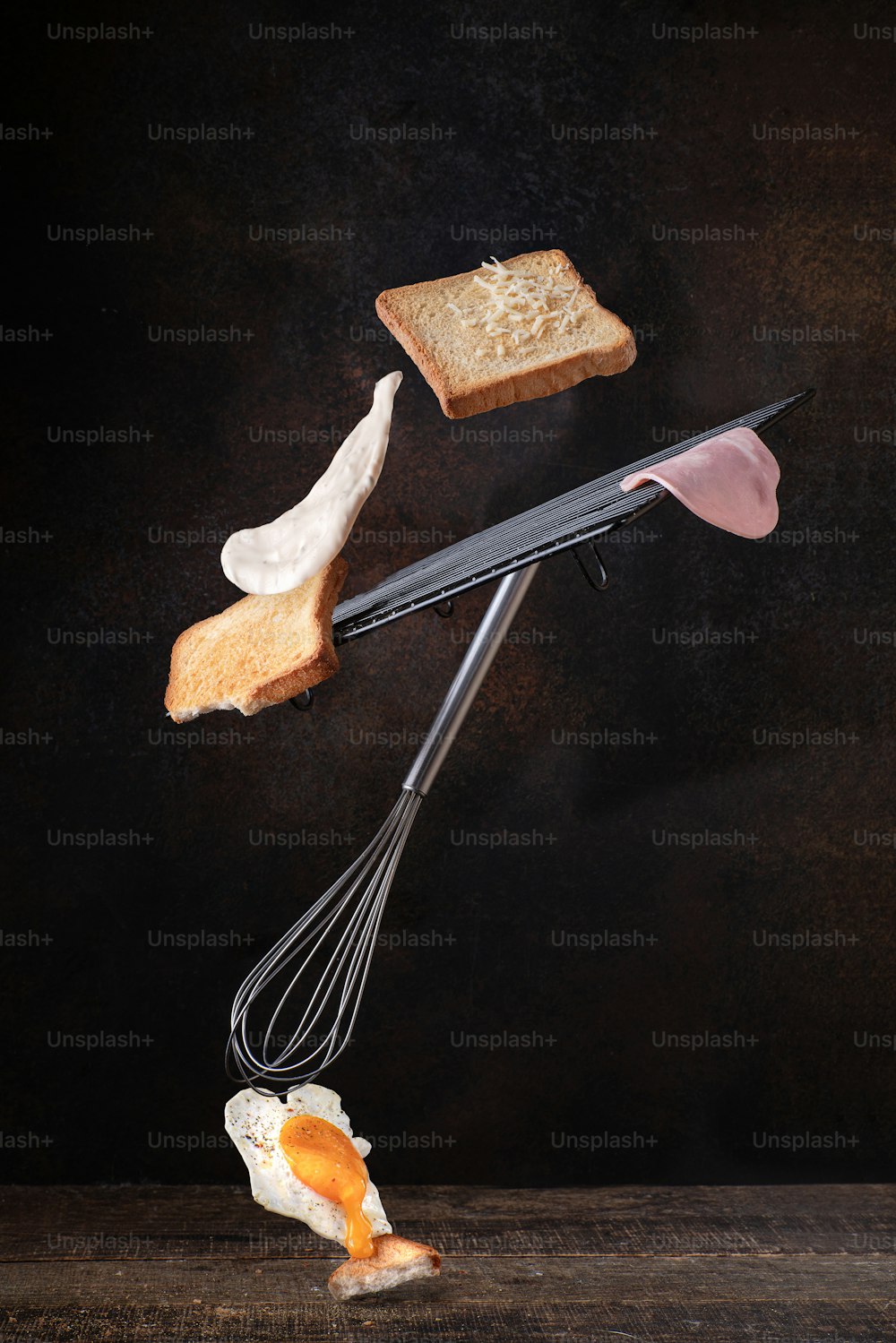 a whisk whisk a piece of bread and an egg on a