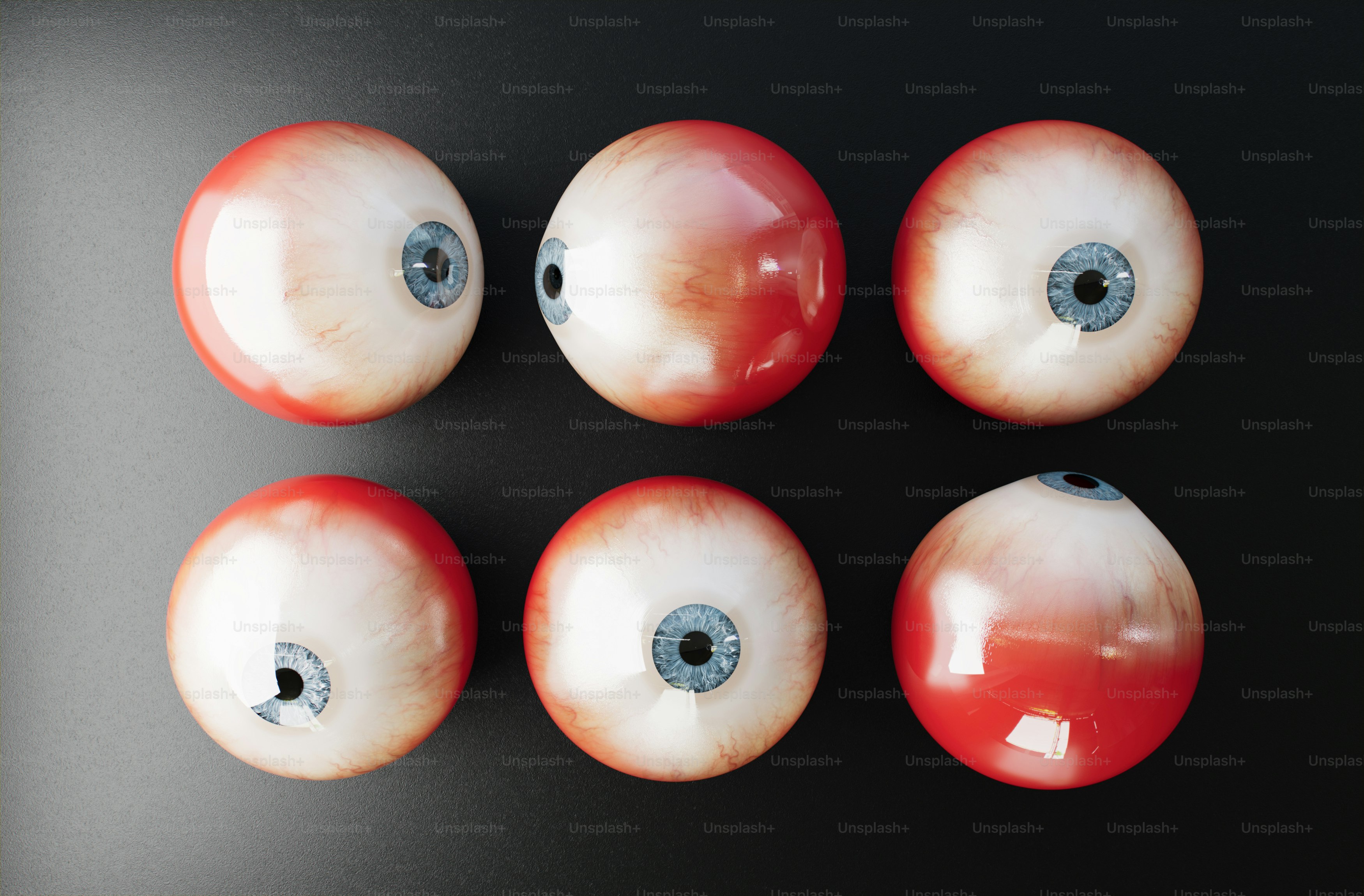 a group of red and white balls sitting on top of a table