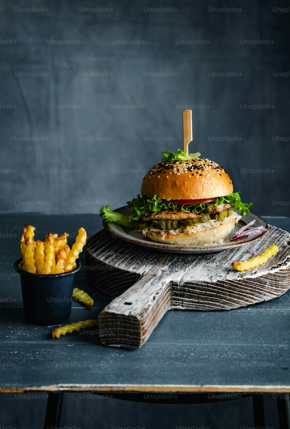 a hamburger and french fries on a table